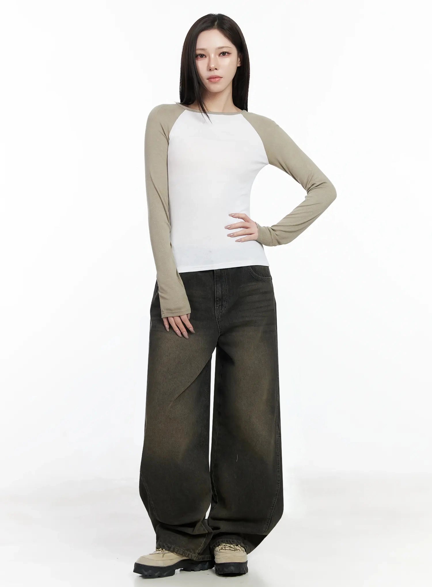 Tracey Vintage Black Washed Wide Leg Jeans IJ528 in black, full-body front shot on model, ultra-wide balloon leg with vintage brown wash, paired with white raglan long sleeve top, chunky sneakers.
