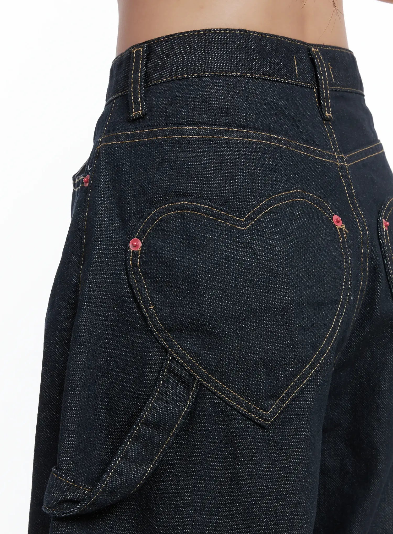 Heart Pocket Balloon Jeans CS503 in dark indigo, angled back close-up, heart pocket topstitch detail with red rivet accents, cotton denim texture, and wide-leg silhouette visible.
