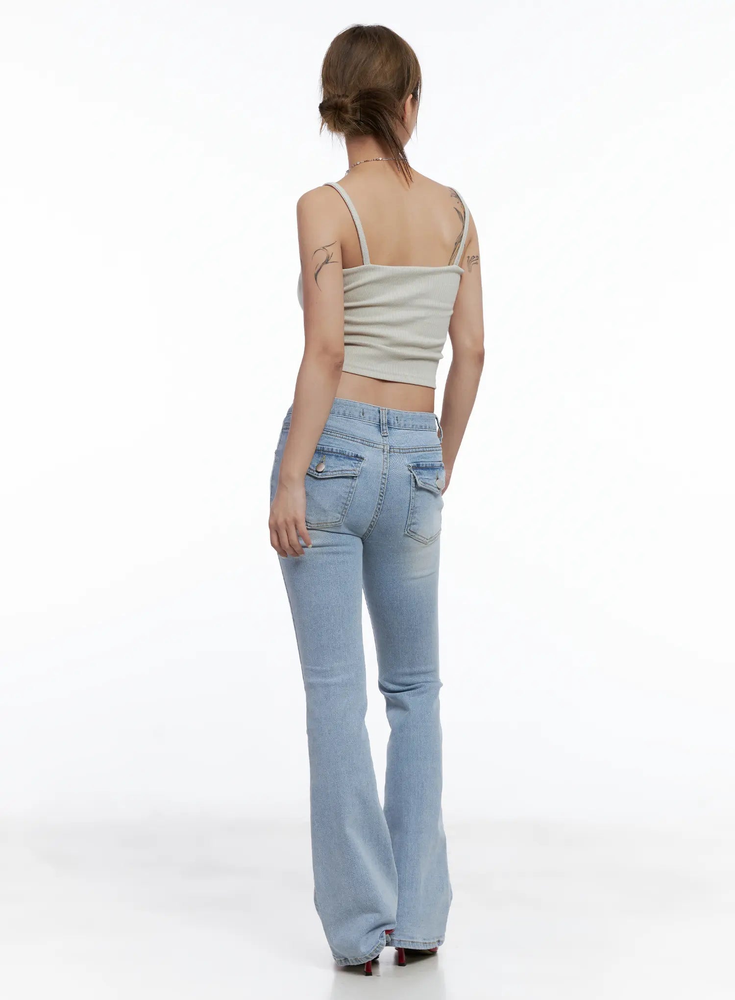 Yeojin Classic Flare Denim Jeans CL510 in light blue, back full-length view on model, back pockets and flare silhouette, styled with beige ribbed cami top and red heels.