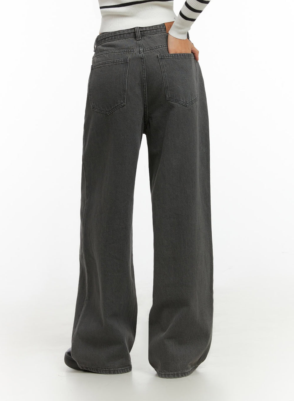 Emery Cotton Strap Baggy Jeans IO409 in dark gray, back close-up on model, detailing dual back patch pockets and straight wide-leg hem, with striped crop top.