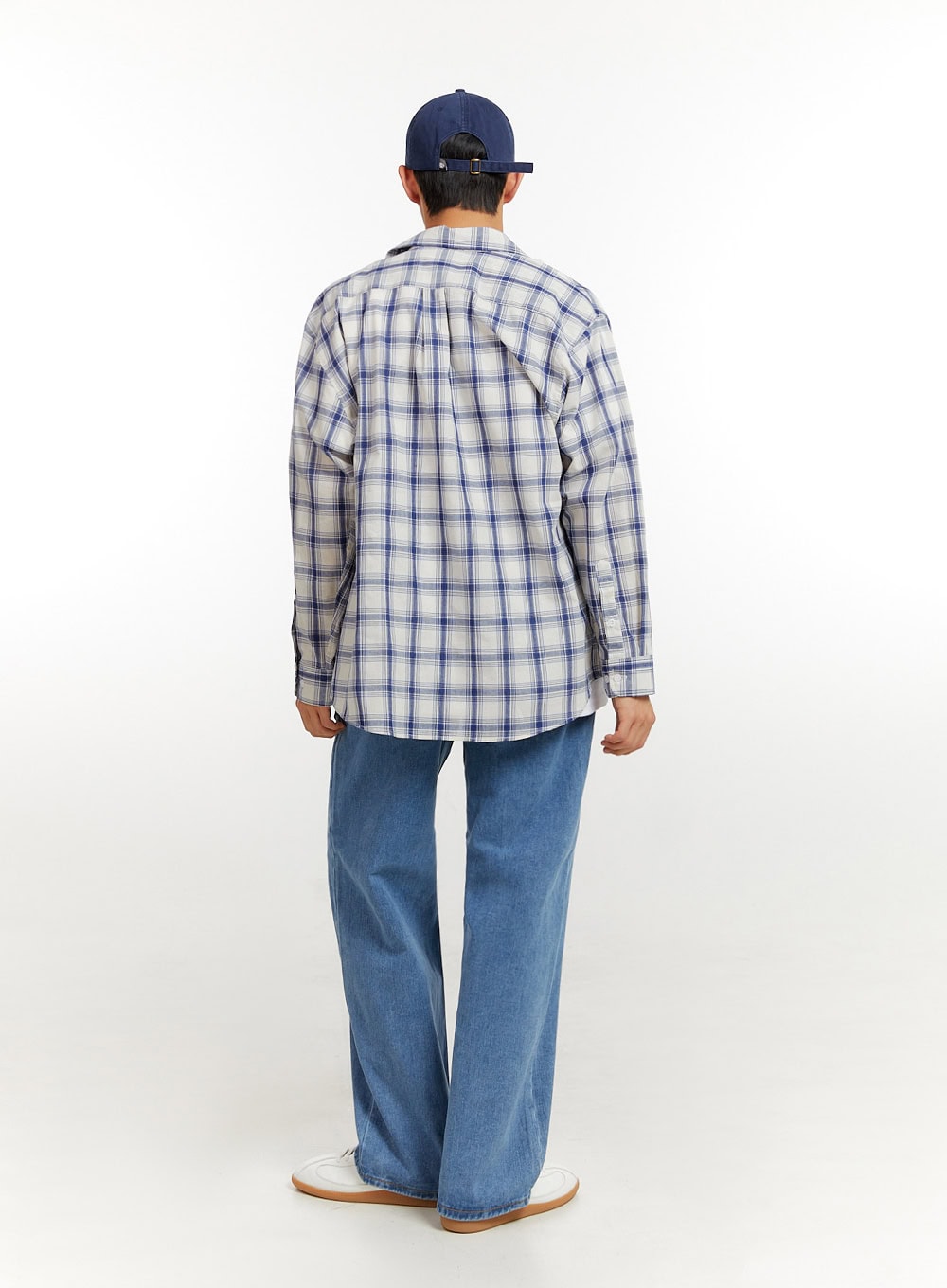 Men's Baggy Jeans (Blue) IU427 in blue, full-body back shot on model, wide-leg denim with relaxed fit, paired with plaid overshirt and navy cap.
