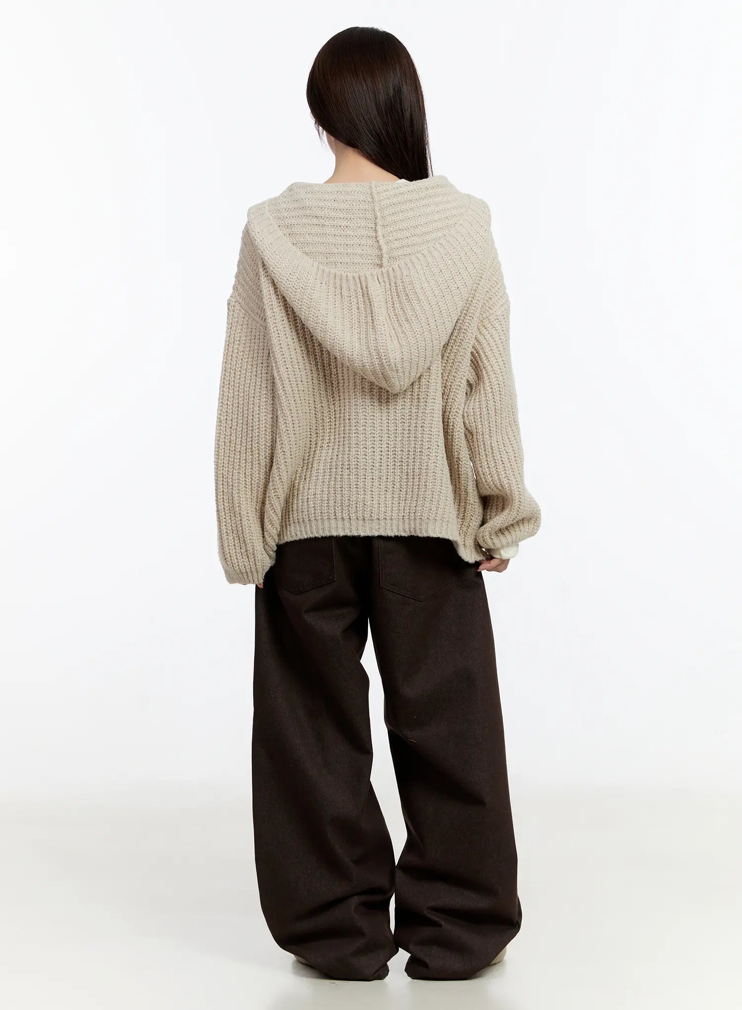 Emely Wide Leg Jeans CN524 in dark brown, back full-length view on model, voluminous wide-leg denim silhouette, styled with oversized beige chunky-knit hooded sweater.