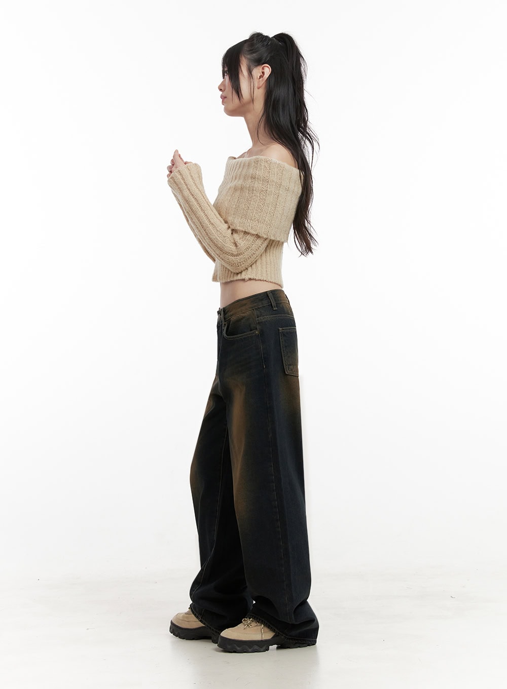 Alexia Washed Denim Wide-Leg Jeans ID402 in dark blue, full-length side shot on model in profile, wide-leg washed denim with amber gradient, low rise waist, paired with beige knit crop.