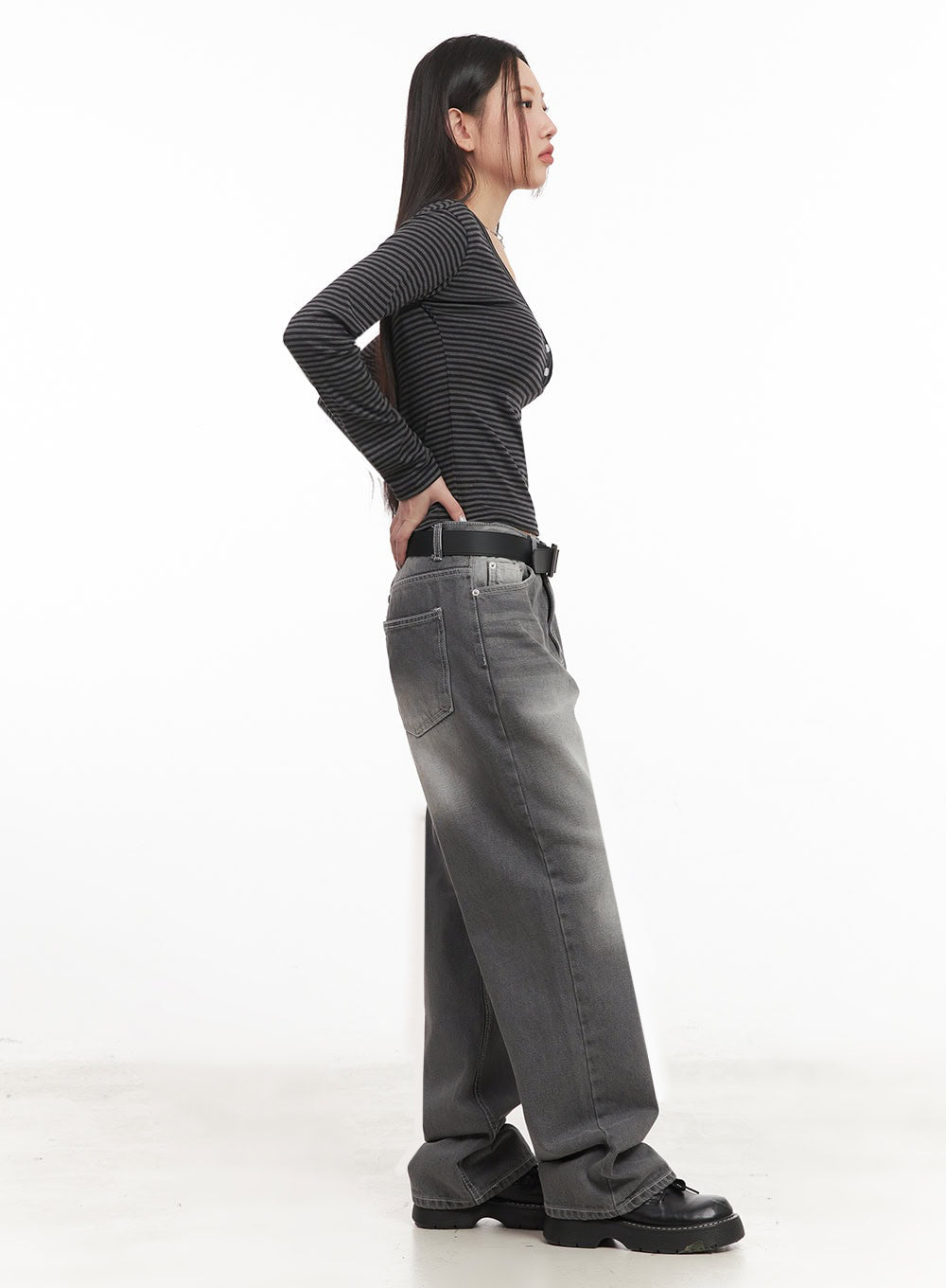 Becca Washed Straight-Leg Jeans IM524 in grey, side view on model, wide-leg washed denim showing straight silhouette and back pocket placement, styled with striped crop top and belt.