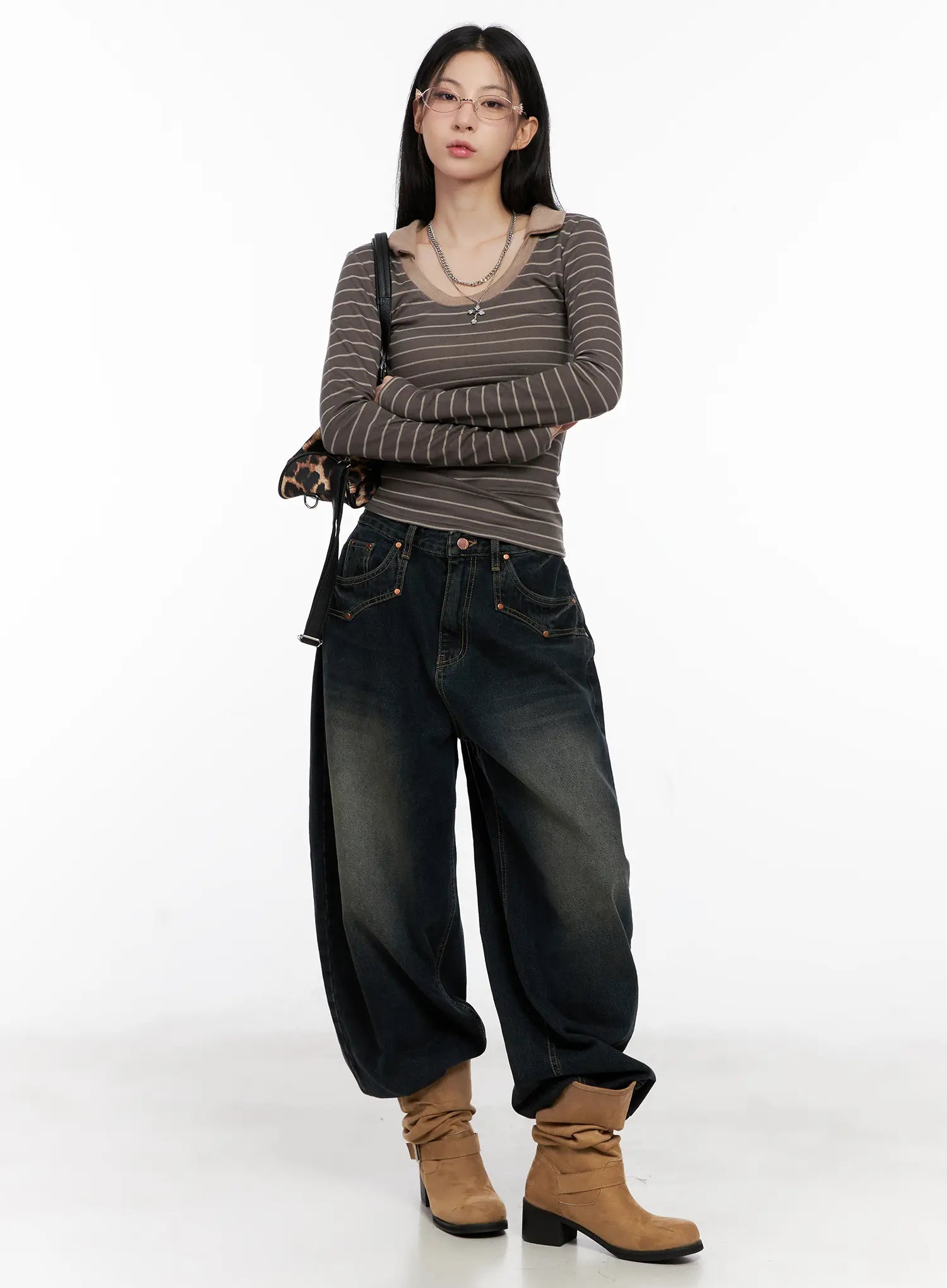 Hyer Washed Wide-Leg Jeans CG522 in dark blue, full-body front view on model, baggy wide-leg silhouette styled with brown striped long-sleeve top, tan cowboy boots, pink tinted glasses, and leopard bag.