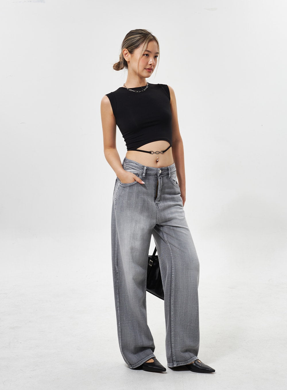 Mid-Rise Wide Leg Jeans CY330 in grey, full-length side-angle shot on model, wide-leg faded denim with relaxed drape, black crop top and bag styling.