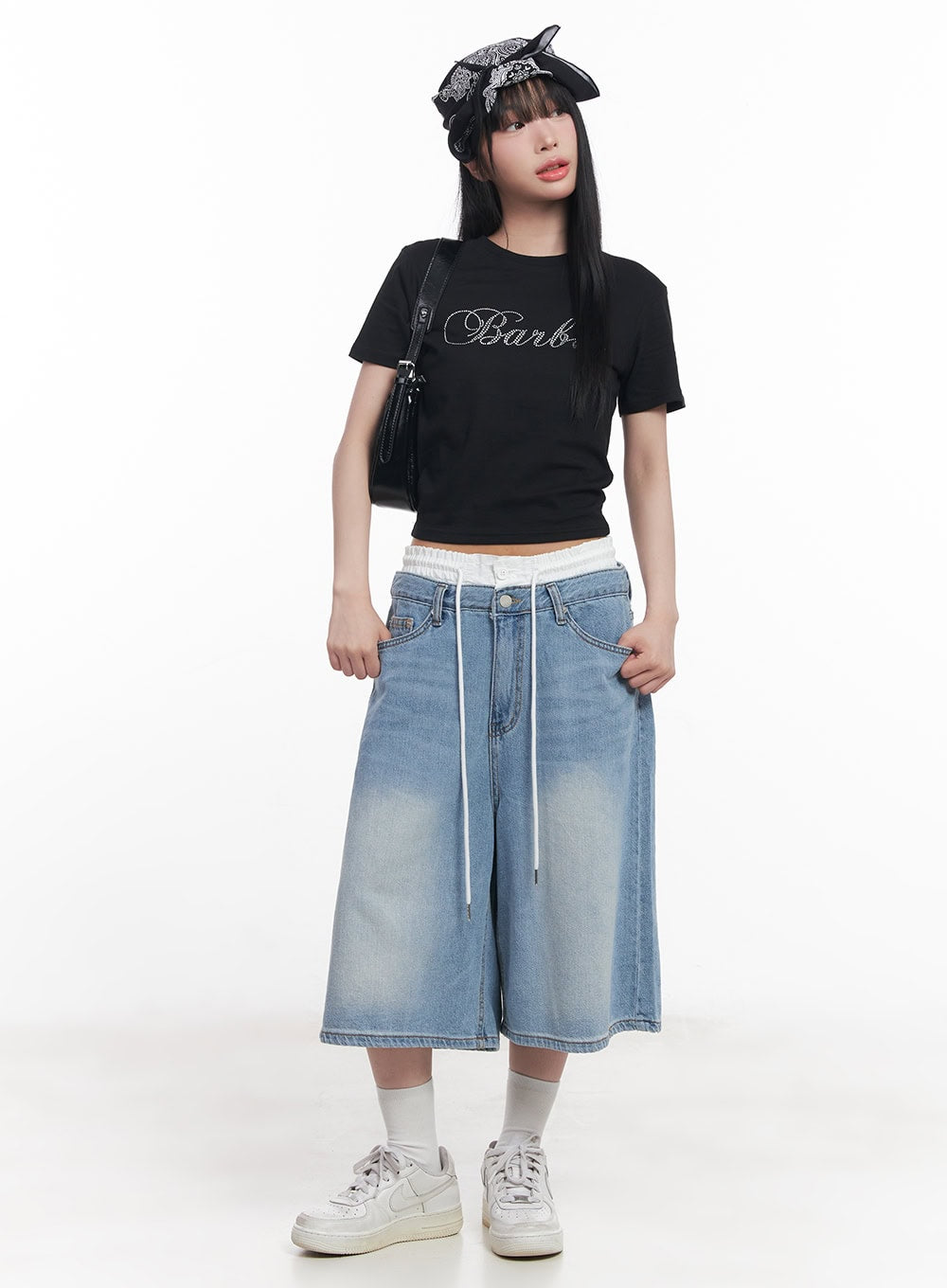Layered Drawstring Baggy Jorts CY527 in light blue, full-body front on model, washed wide-leg midi jorts with white layered drawstring waistband, styled with black graphic crop tee, bandana headscarf, and white sneakers.