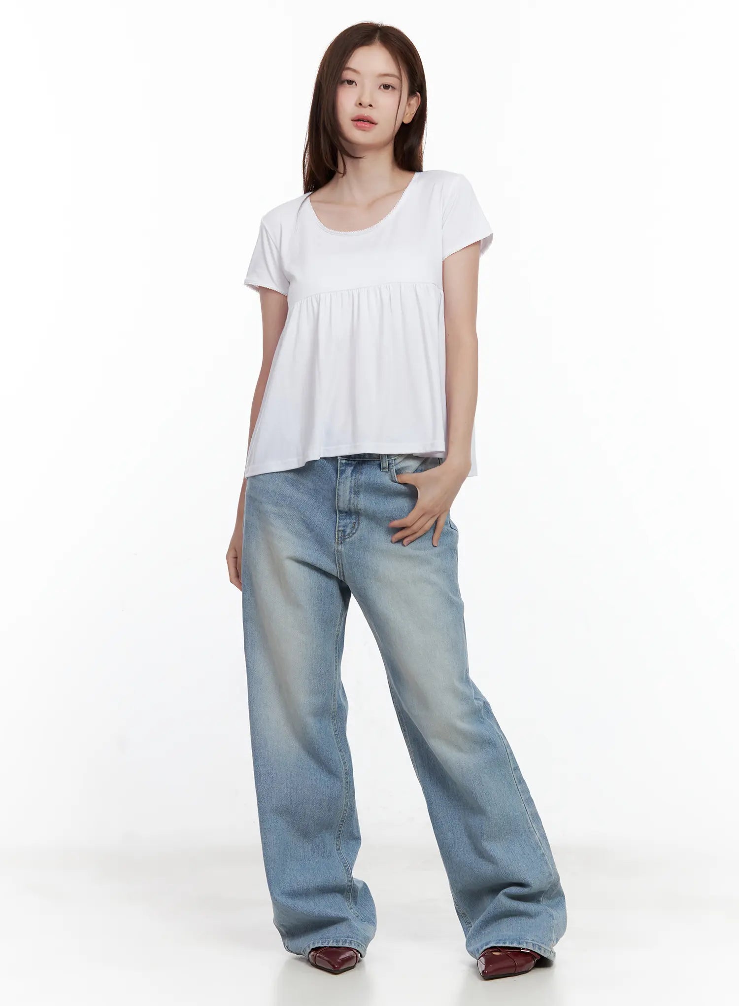 Ina Slouchy Fit Jeans CL502 in blue, full-body front shot on model, loose wide-leg washed denim paired with white ruched babydoll tee, casual summer outfit, burgundy loafers.