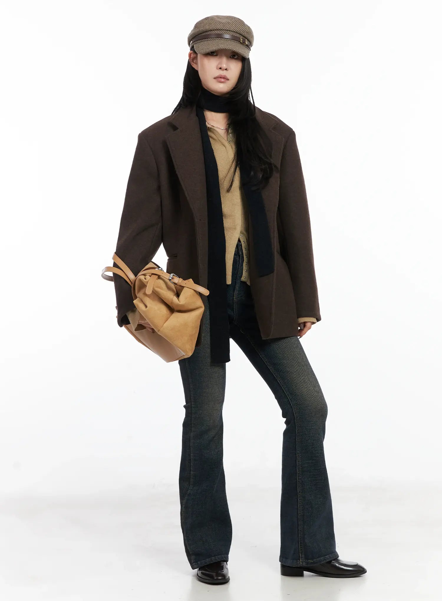 Jordyn High-Waist Bootcut Jeans CD502 in dark washed indigo, full-length front editorial shot on model, bootcut flare at ankle, layered under dark brown wool blazer, black scarf, and tweed baker boy cap.