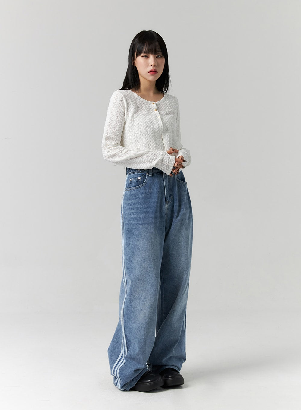 Side Stripes Wide Leg Jeans CS314 in blue, full-length front view on model with side stripes visible, washed denim wide leg pooling at floor, paired with white cropped cardigan.