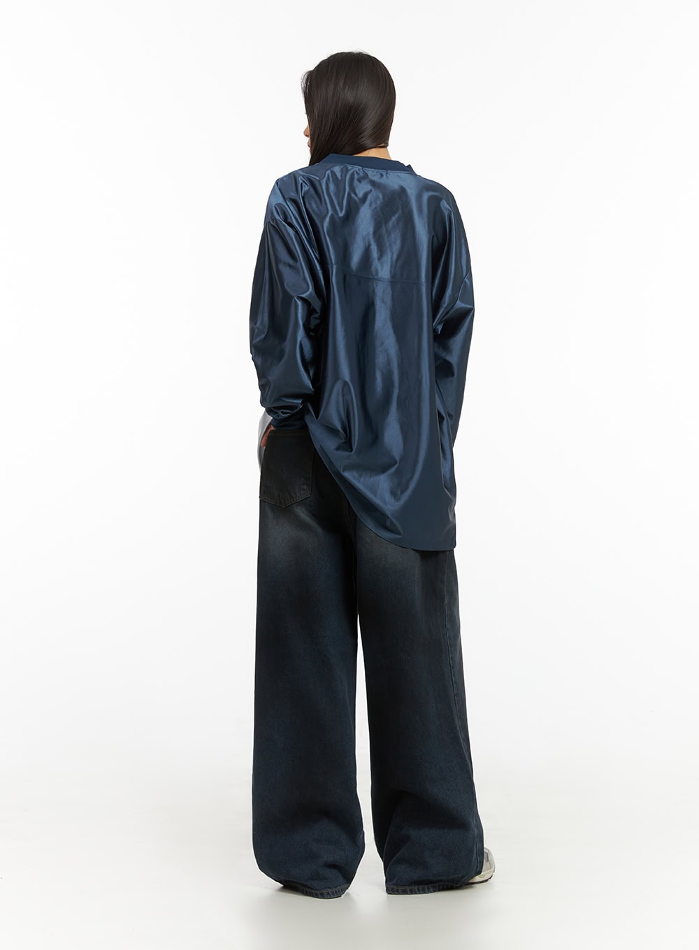 Imogen WashedSky Loose-Fit Denim IO409 in dark blue, full-body back view on model, wide-leg washed denim with dual back pockets, hand in pocket pose, styled with sporty top.