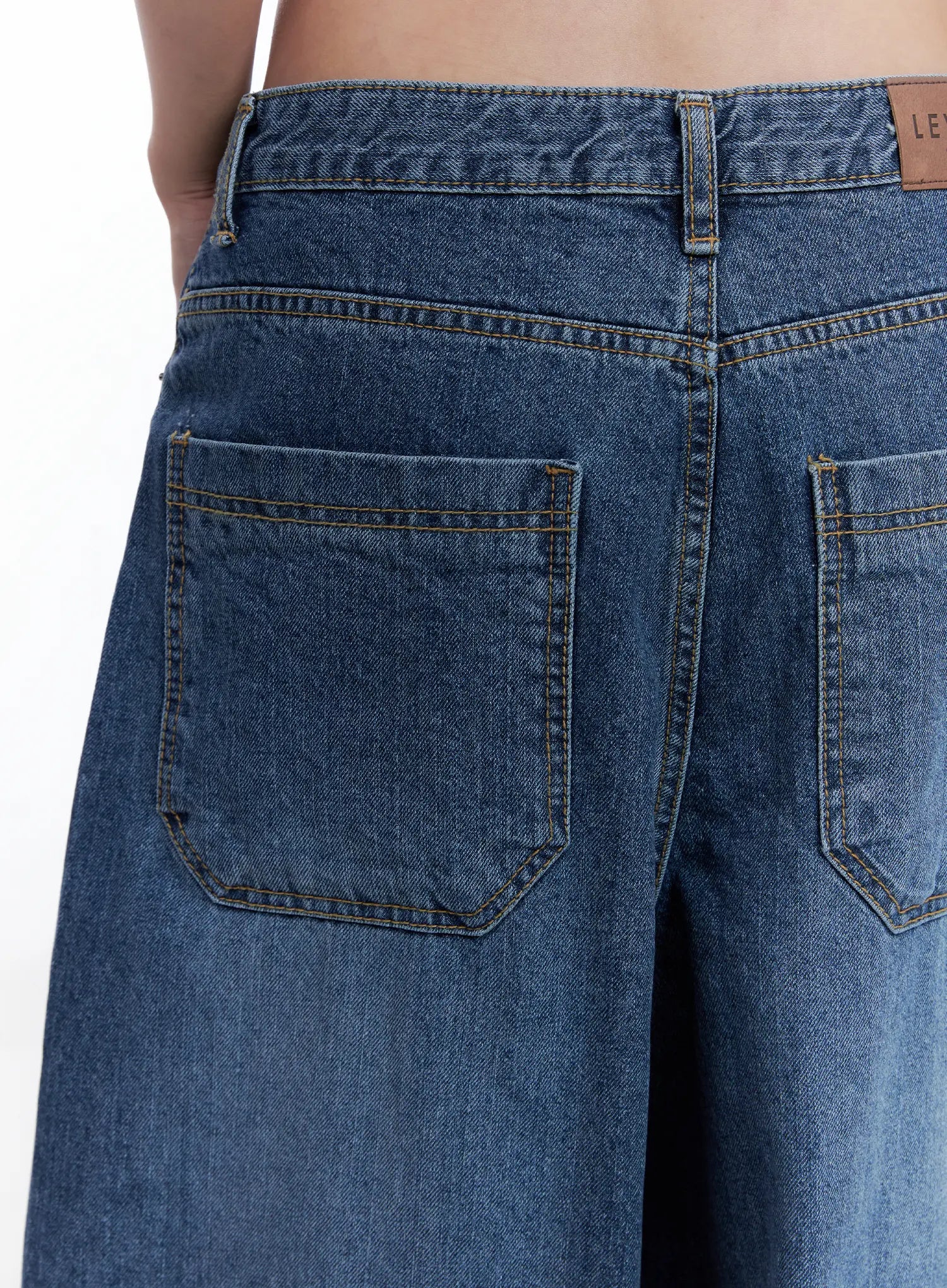 Shuhua Washed Wide-Leg Denim Jeans CL510 in dark blue, close-up back detail showing patch pockets, contrast topstitching, leather brand tab on waistband.