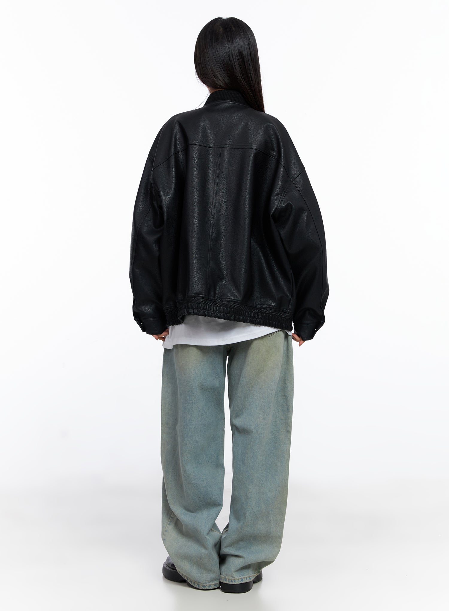 Remi Washed Baggy Jeans CO515 in light blue, back full-body styling shot, model in black leather bomber over white tee, wide-leg jeans with washed finish and black loafers.