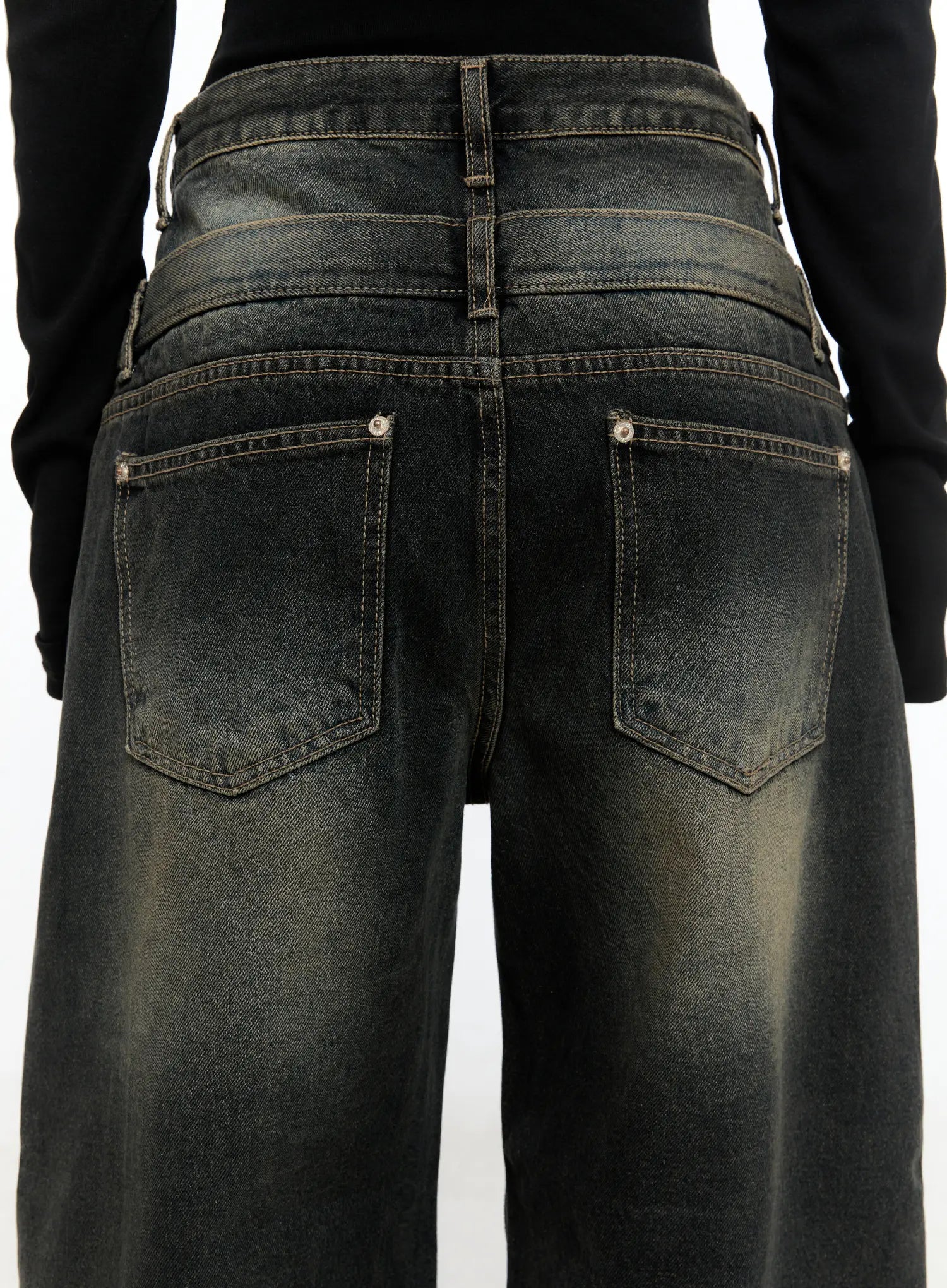 Emerie Washed Wide-Leg Baggy Jeans CS518 in dark blue, close-up back detail on model, highlighting twin back pockets with rivet studs, contrast stitching, and layered waistband construction.