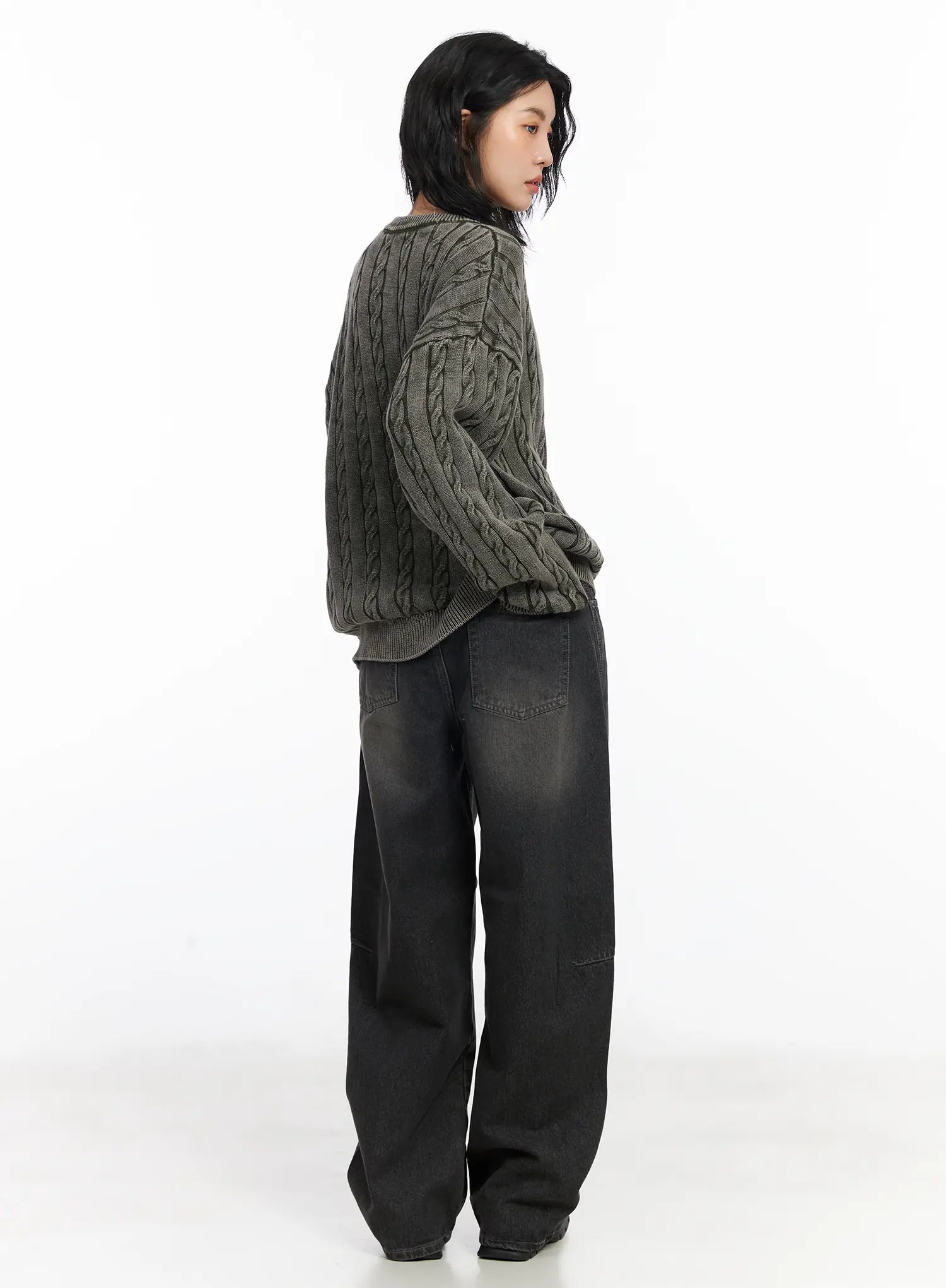 Nayeli Baggy Jeans CJ522 in dark gray, three-quarter back shot on model, washed wide-leg cotton denim with panel stitching, styled with gray cable-knit sweater.