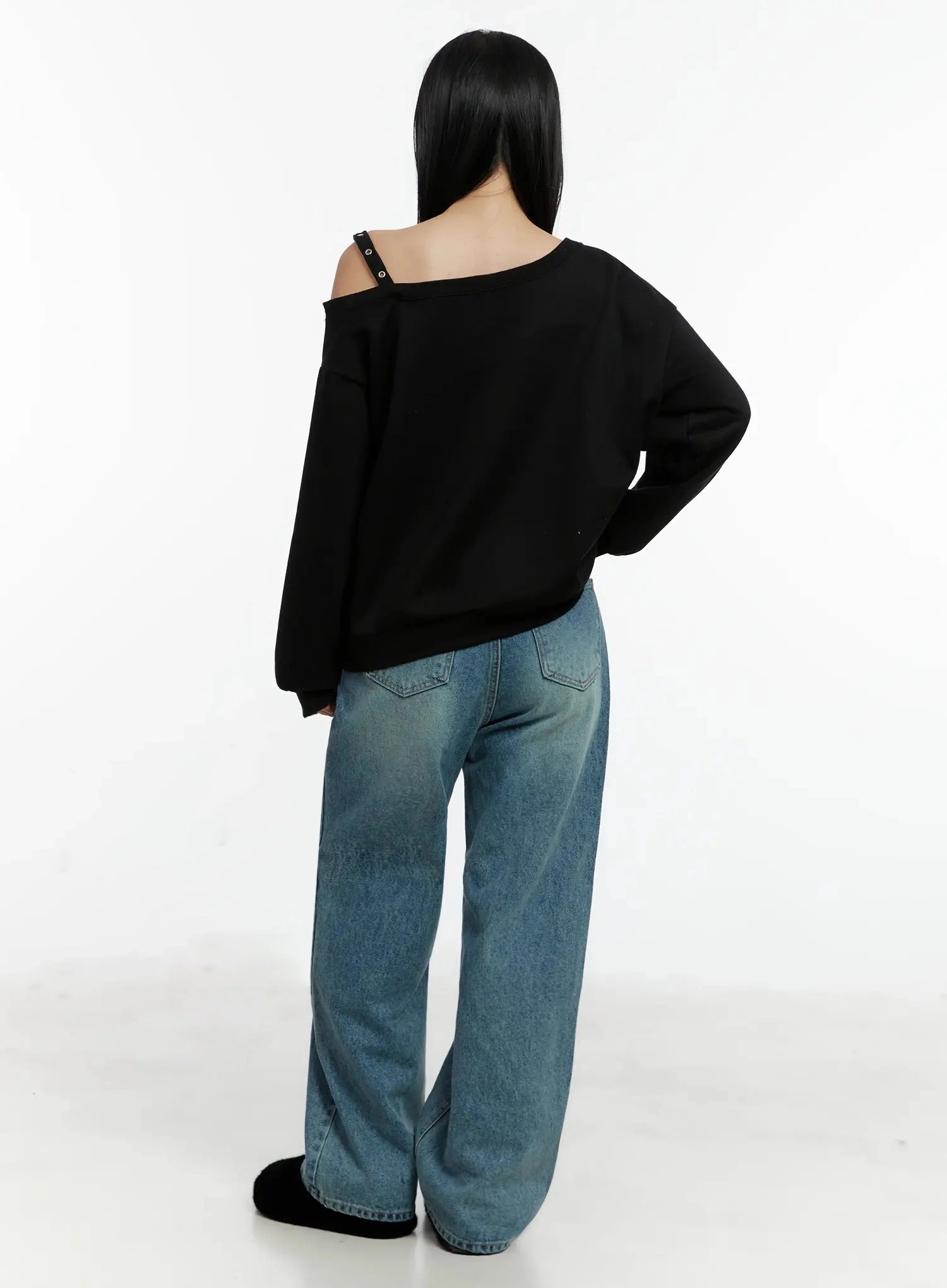 Pixi Straight Leg Jeans ID525 in blue, back full-body shot on model, revealing back pockets with stitch detail and relaxed straight leg on washed blue cotton denim, styled with black off-shoulder sweatshirt.