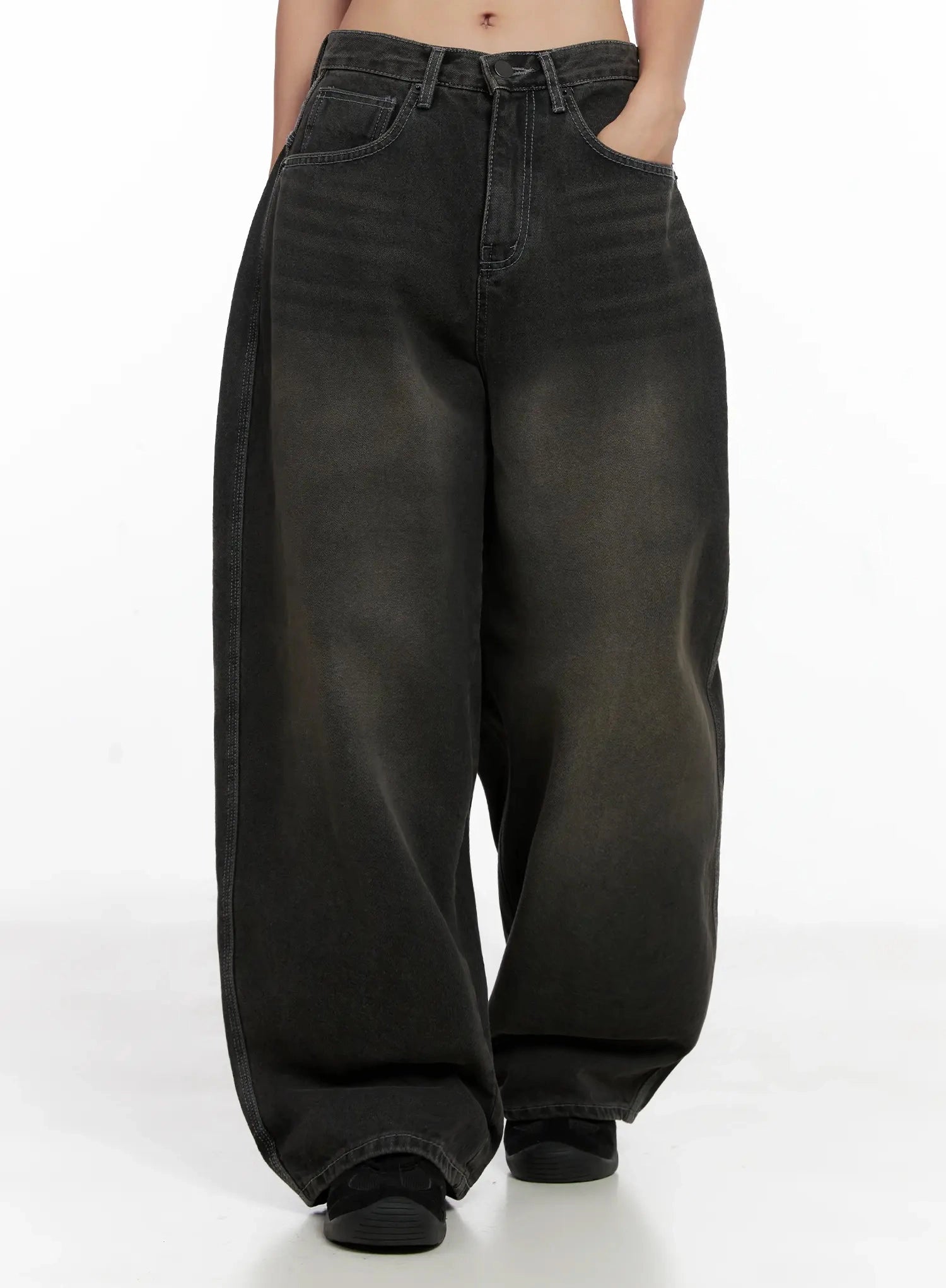 Hari Dark Washed Baggy Jeans IG527 in dark grey, front walking shot on model, extreme wide-leg baggy fit, faded wash with brown tonal gradient, high waist with front pockets, long hem at floor.