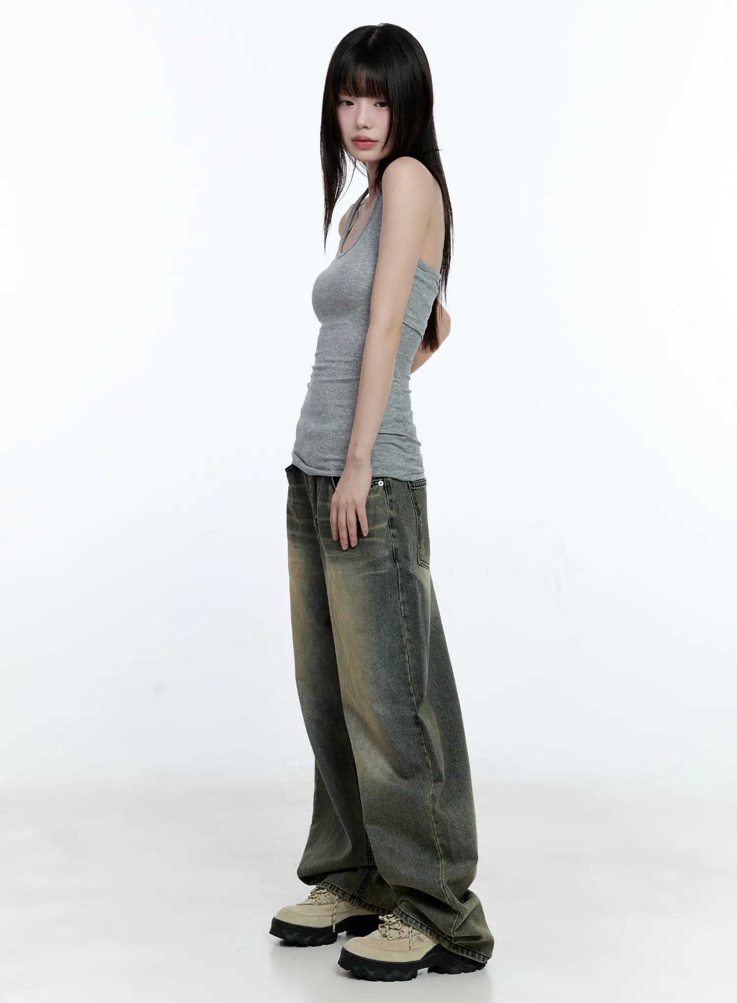 Yeonsoo Vintage-Wash Wide-Leg Jeans CG507 in vintage blue, side profile view on model, full-length silhouette showing exaggerated wide-leg flare and vintage yellow-green wash gradient.