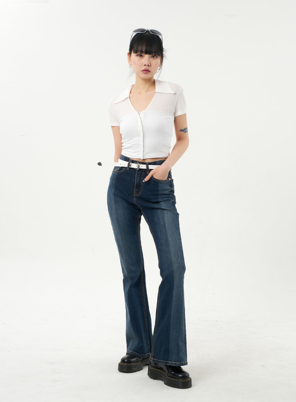 Dark Wash Bootcut Jeans CA328 in dark blue, full front view on model facing forward, hands in pocket, slim washed denim bootcut, paired with white crop polo top.