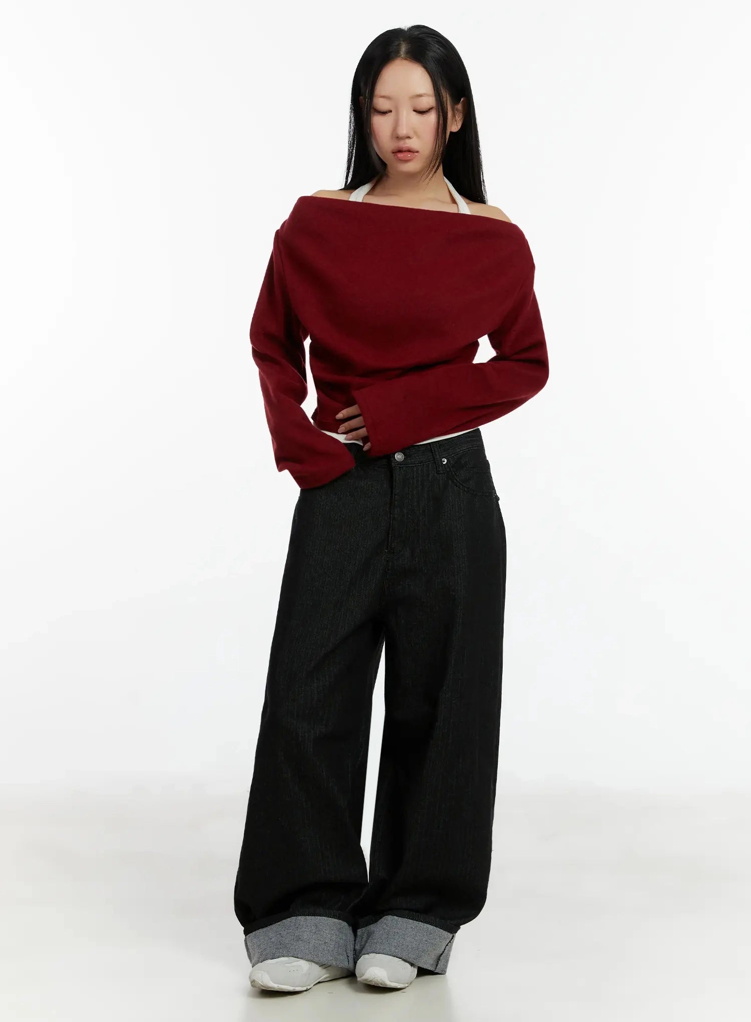 Amyra Baggy Striped Jeans ID525 in black, full-body front view on model, paired with red off-shoulder knit top, wide baggy fit with grey cuffed hem, white sneakers, acubi style.