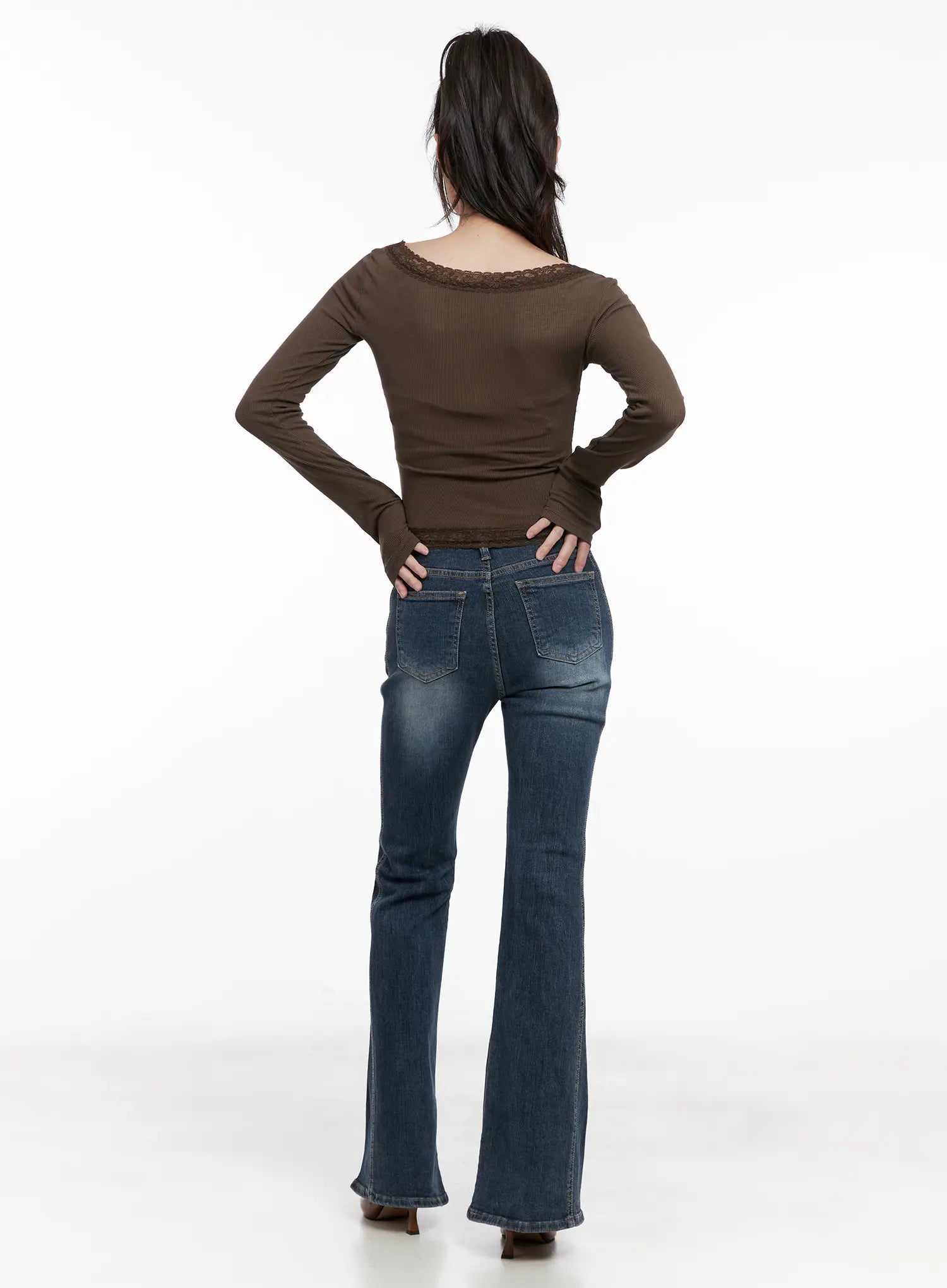 Giana High Waist Hip Pad Flare Jeans CG519 in blue, back full-body on model styled with brown lace-trim top, hands on hips, back pockets and flare leg visible.