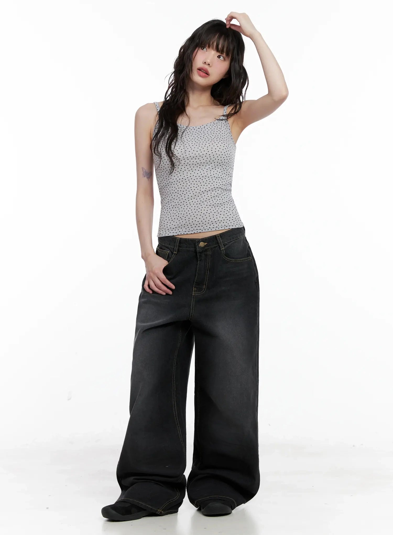 IU Vintage Black Baggy Jeans IL528 in black, full-body front shot on model, styled with polka-dot cami and belt, low-rise washed wide-leg cotton denim, floor-length hem.
