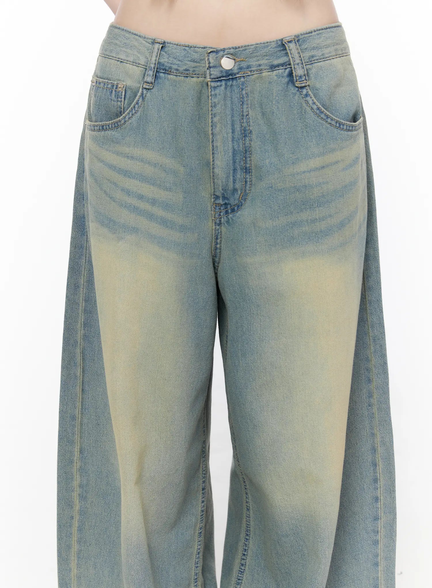 Rain Vintage Washed Wide Leg Jeans CU519 in light blue, close-up front detail on model, waistband with button closure, front pockets, and yellow sun-faded vintage wash whisker detailing.