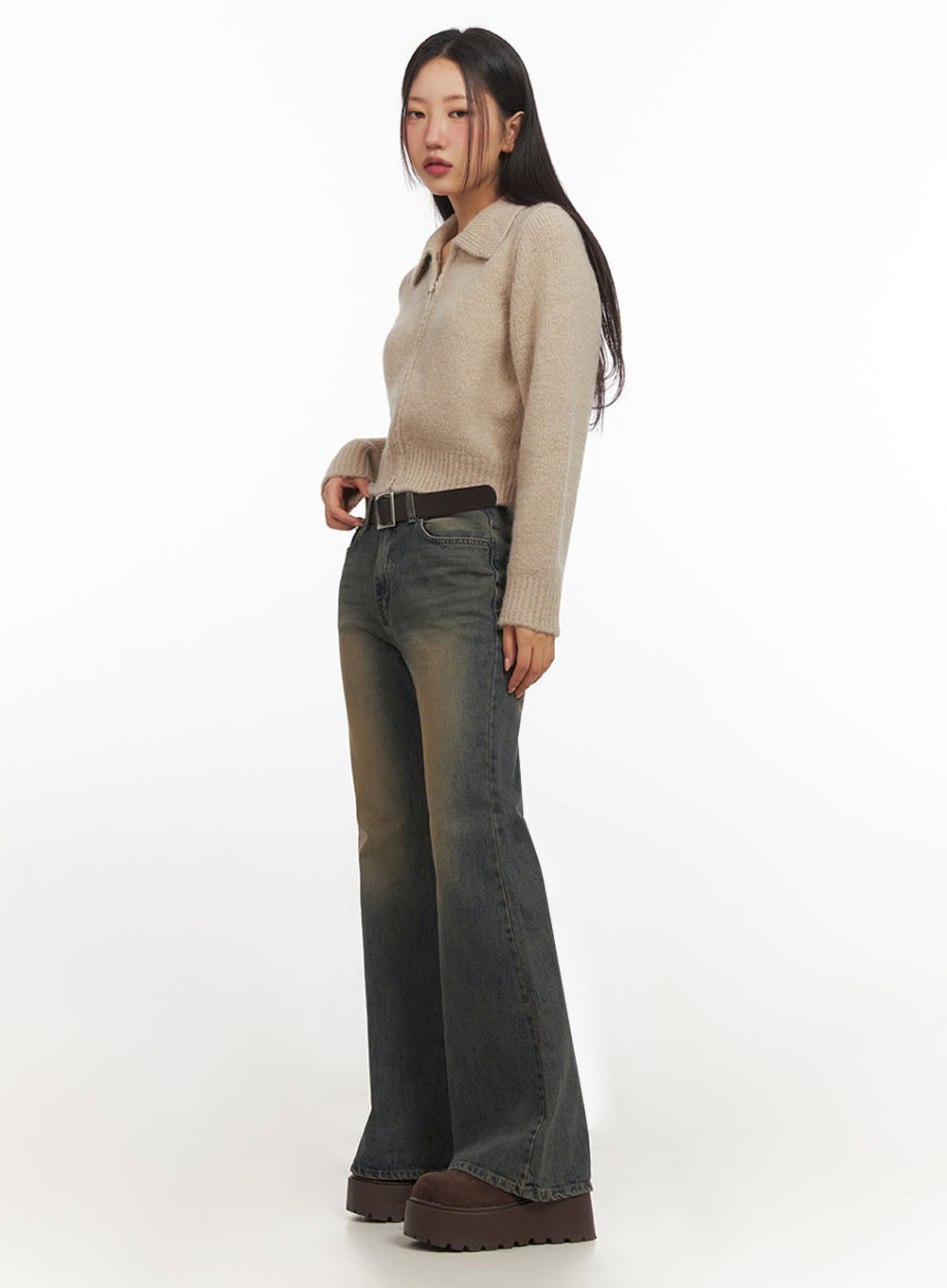Kourtney Vintage Wash Flared Jeans IF510 in dark blue, full-length side profile shot on model, slim-fit flared denim with golden vintage wash, paired with beige collar zip knit and brown belt.
