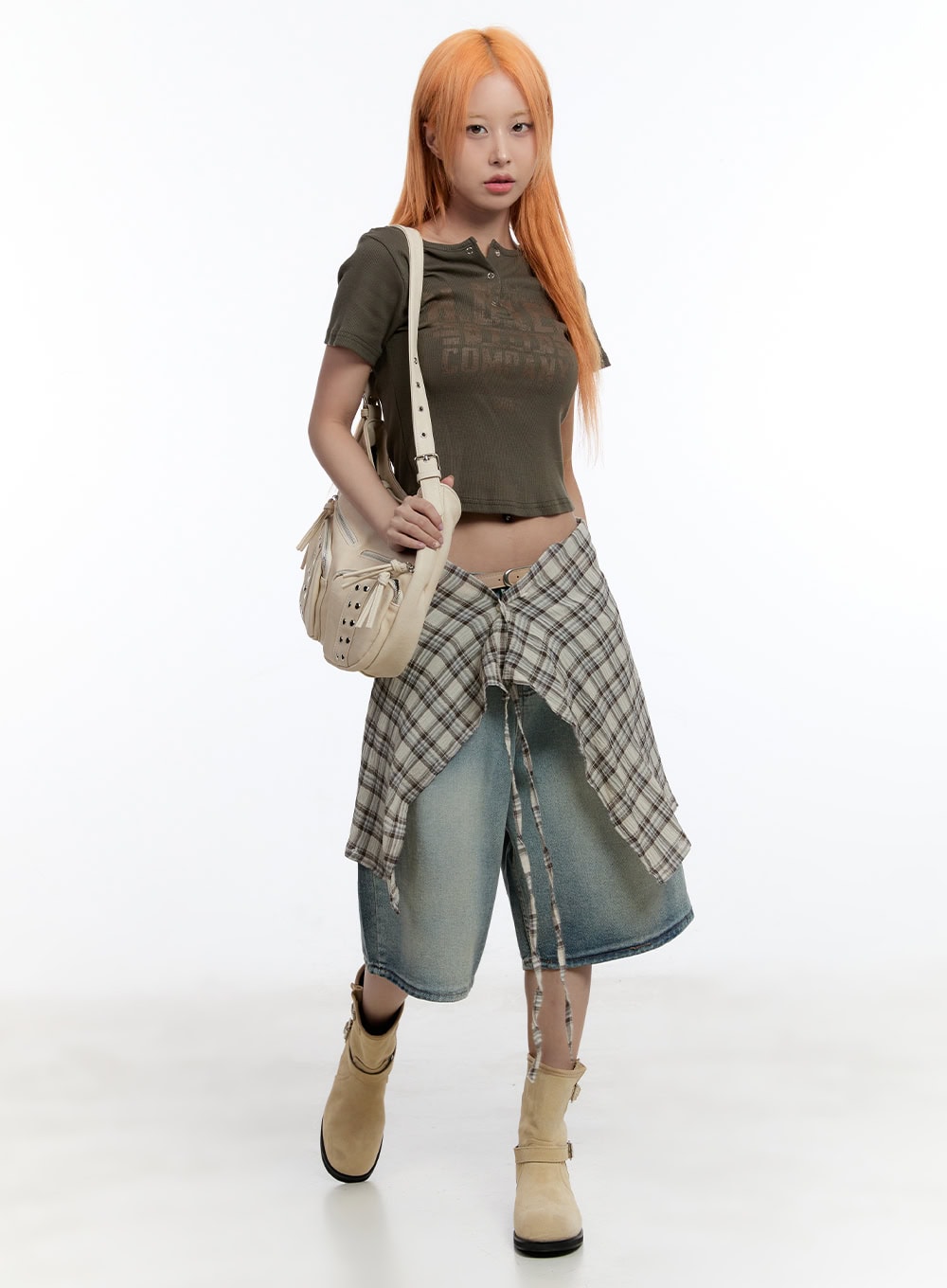 Washed Midi Baggy Jorts CY530 in blue, full-body front on model in motion, plaid shirt tied at waist, olive crop tee, cream shoulder bag and beige boots.
