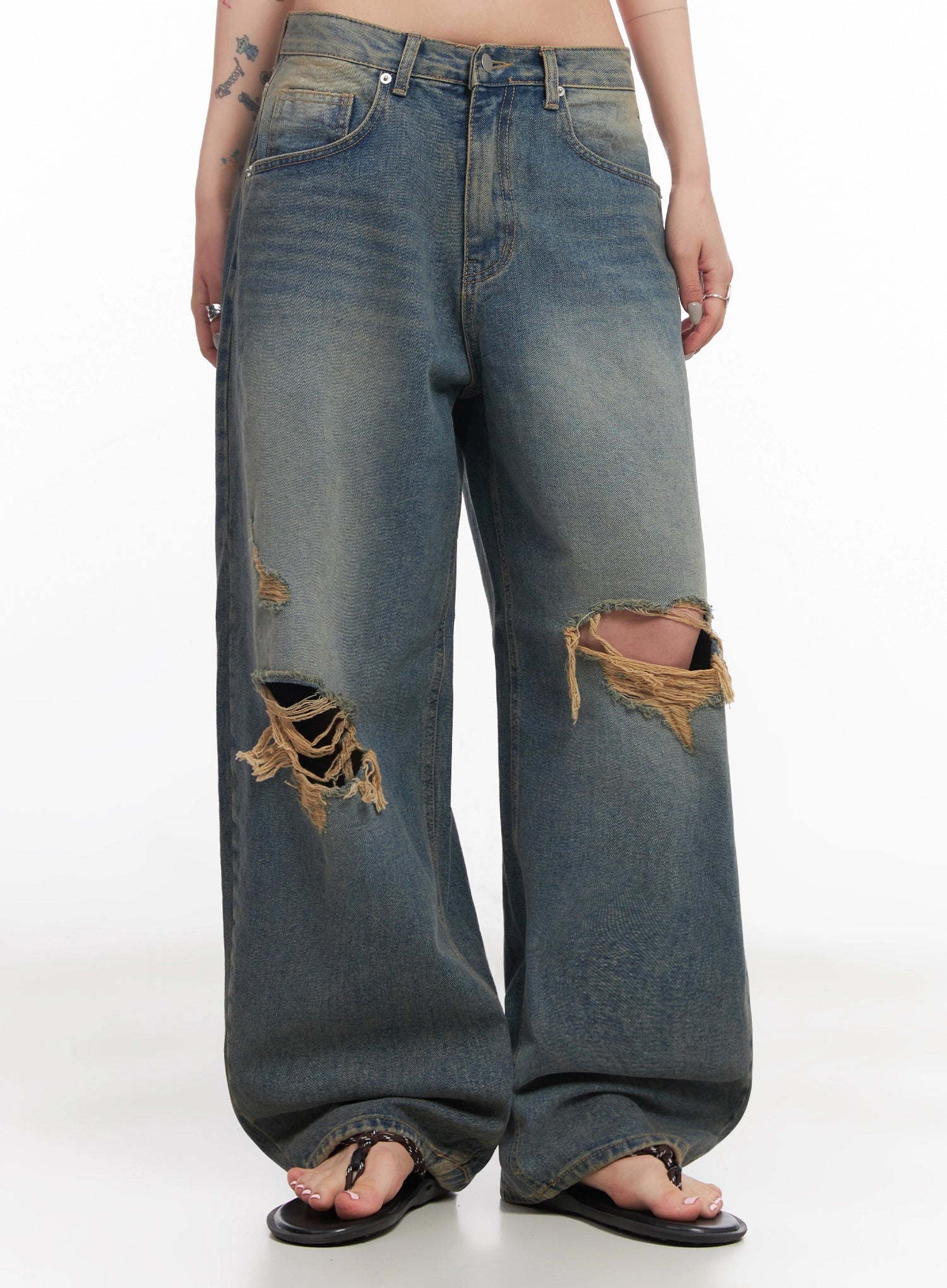 Jeemin Vintage Distressed Wide-Leg Denim Jeans IC503 in washed blue, front lower-body shot on model, highlighting low-rise fit, large destroyed openings on both thighs with heavy fraying.