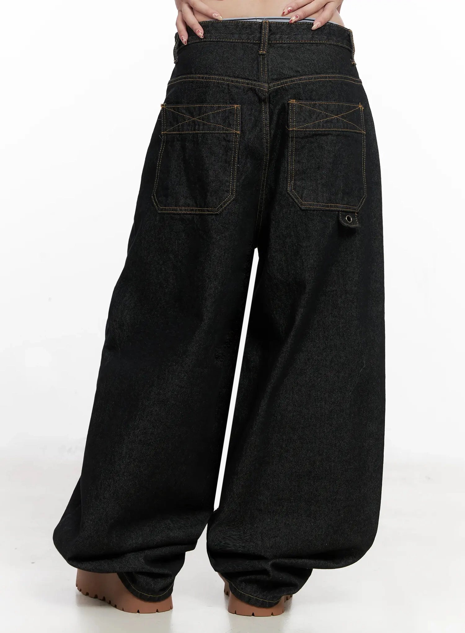 Halo Wide Leg Stitch Detail Jeans IN514 in black, back waist-down shot on model, large patch pockets with X cross-stitch detail and rivet accent, contrast gold topstitching throughout.