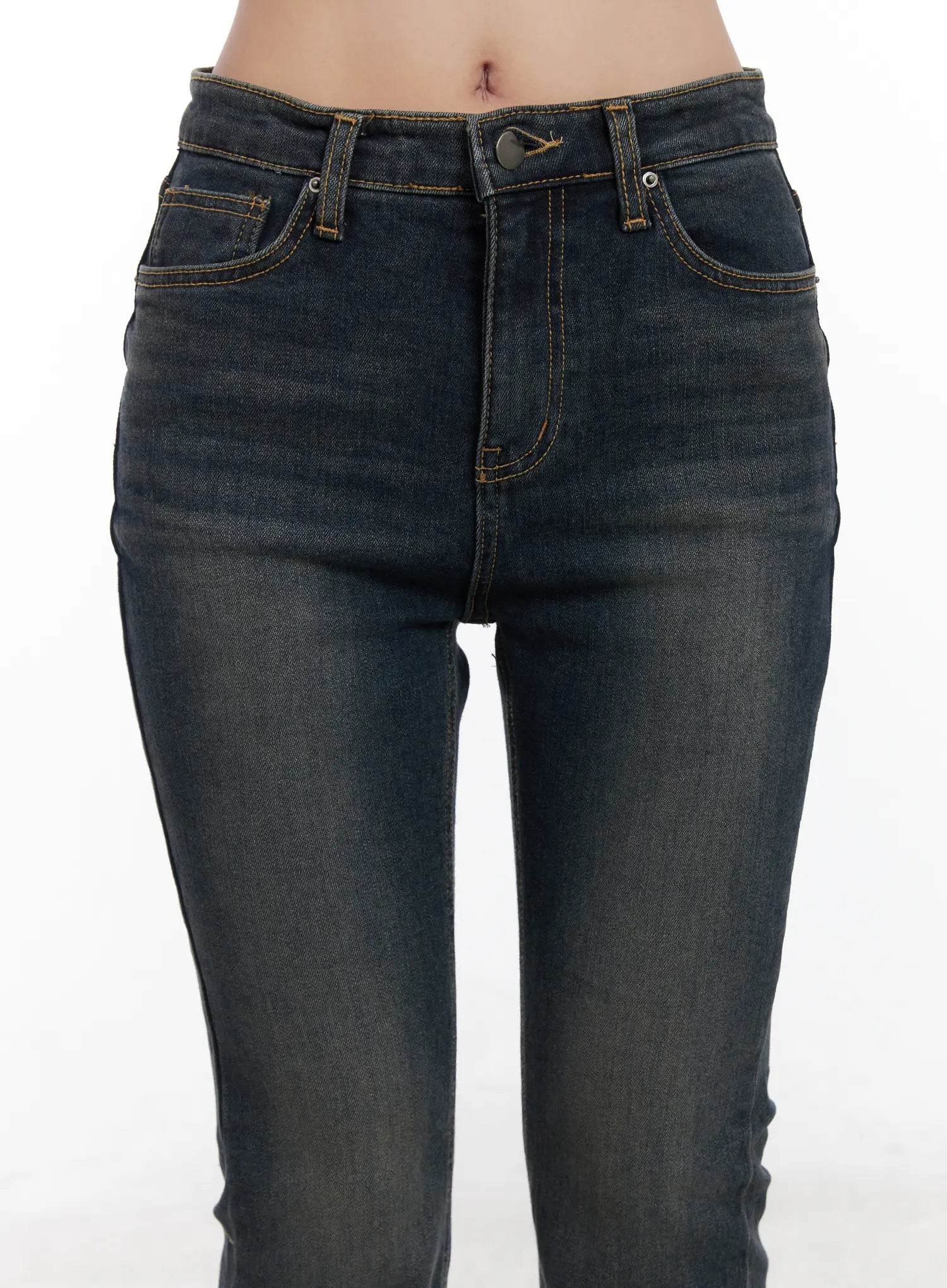 Jay Dark-Wash Bootcut Jeans CD501 in dark blue, close-up front waistband detail on model, button fly, five-pocket construction, gold contrast stitching on dark wash denim.
