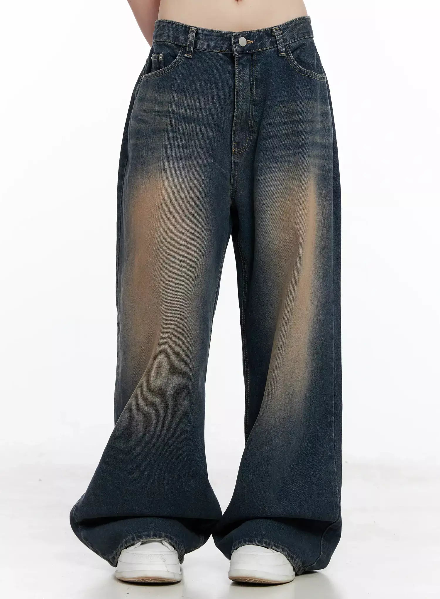 Solji Acid Washed Wide-Leg Jeans IL531 in dark blue, front lower-body shot on model, arms behind back, amber acid-wash gradient across thighs, extra-wide hem pools at sneakers.