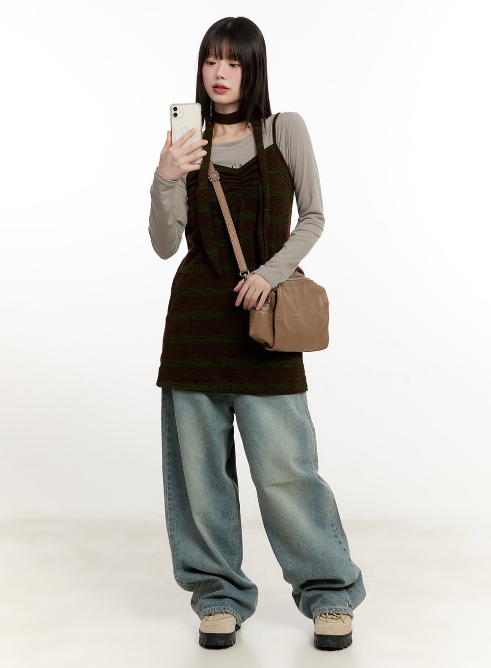 Galinda Washed Baggy Jeans CM513 in vintage blue, full-body front mirror-selfie styling, layered under dark striped knit vest and beige long-sleeve, crossbody bag, street acubi outfit.
