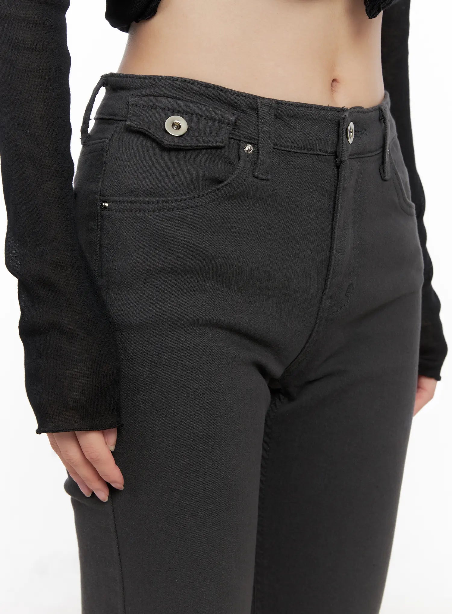 Addie Chic Flared Jeans CG522 in dark gray, front waist close-up on model, mid-rise waistband, button closure, front pockets with snap detail, clean solid denim texture.