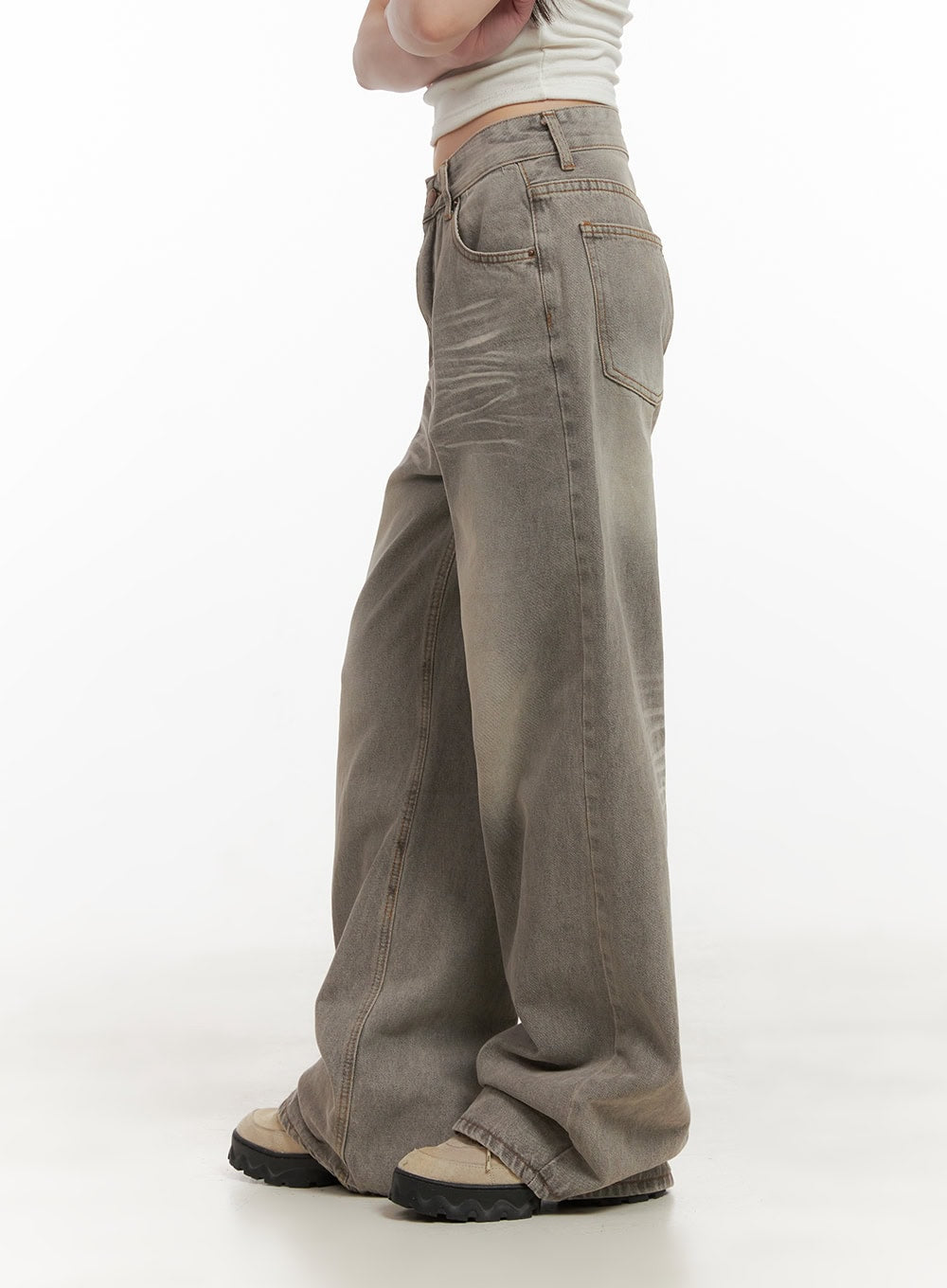 Hollie Vintage Wide-Leg Jeans CD426 in gray, side close-up on model, wide-leg washed denim showing back pocket and seam detail, pooling slightly over chunky platform shoes.