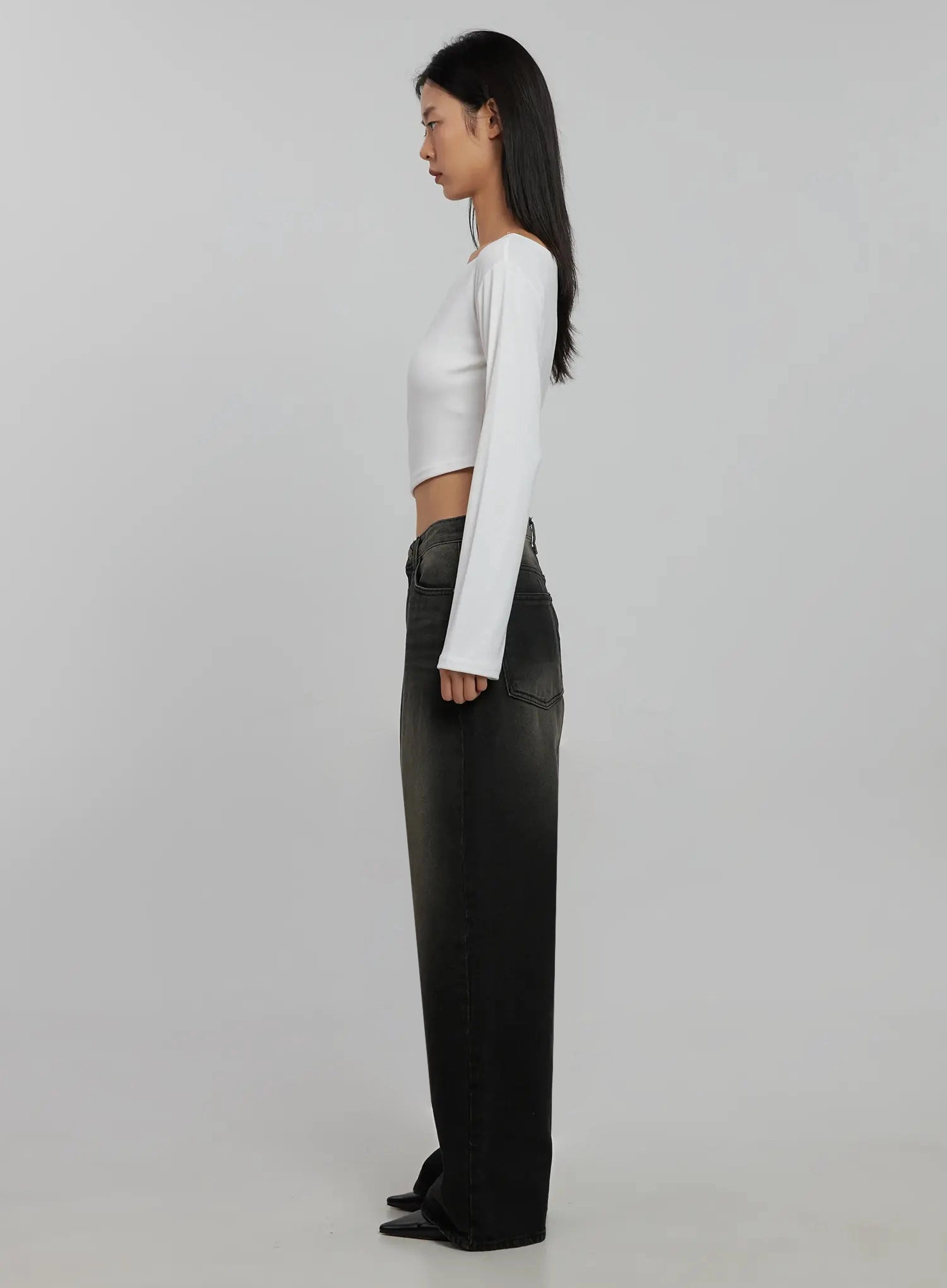 Blaire Dark Washed Wide Leg Jeans IJ509 in black, side-profile full-length shot on model, dark washed cotton wide leg denim showing long straight silhouette and floor-length hem, with white crop top.