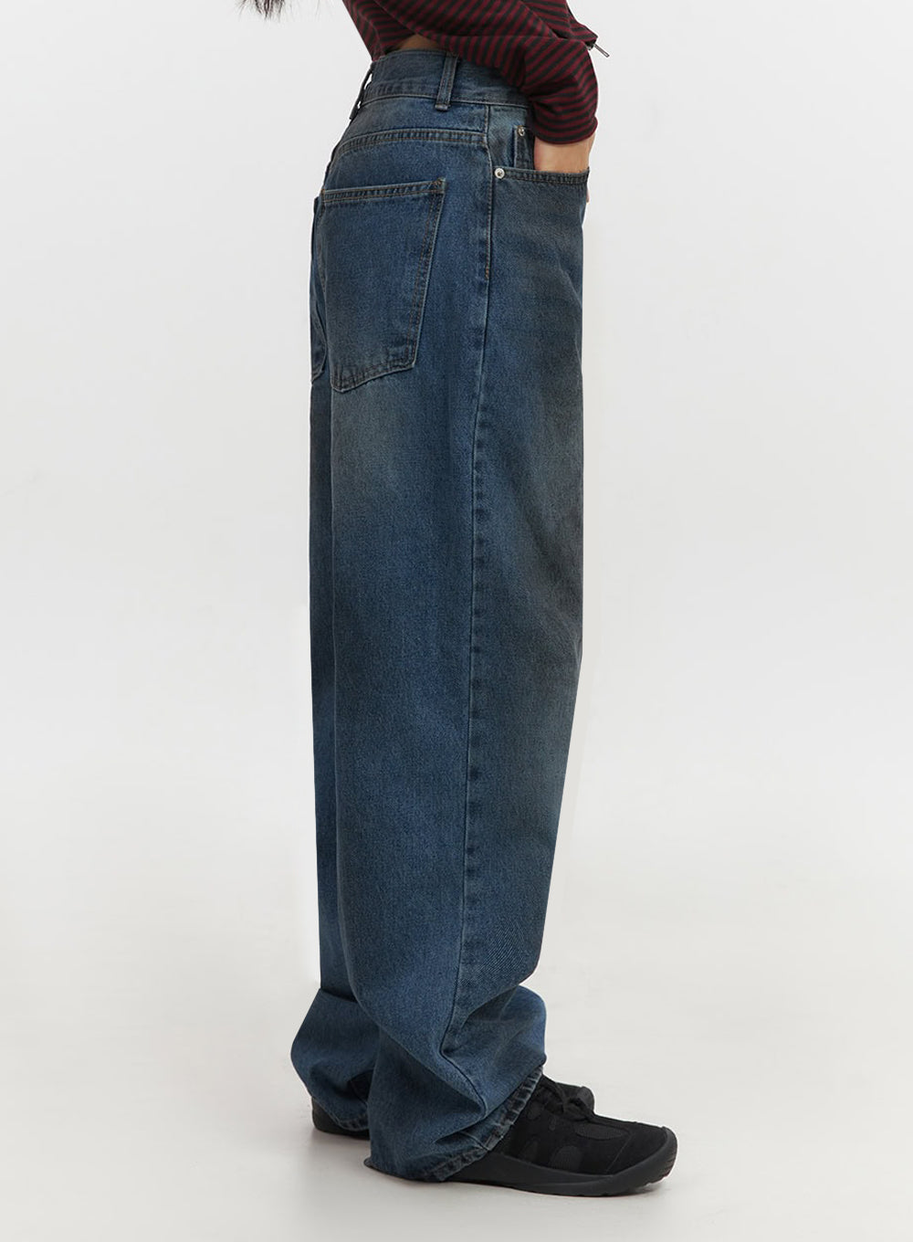 Brianna Dark Washed Wide-Leg Jeans IF510 in dark washed blue, side view on model, baggy wide-leg silhouette with back patch pocket and inseam detail visible, dark fade wash cotton denim.