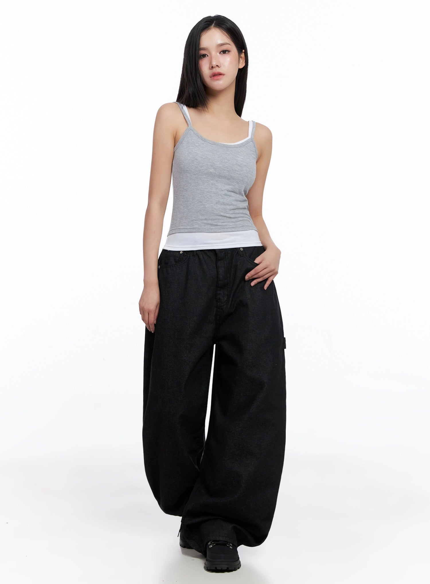 Lea Cross-Patch Baggy Jeans IS525 in black, front full-body shot on model standing straight, loose baggy cotton denim with oversized wide leg, paired with grey layered cami top and black platform boots.