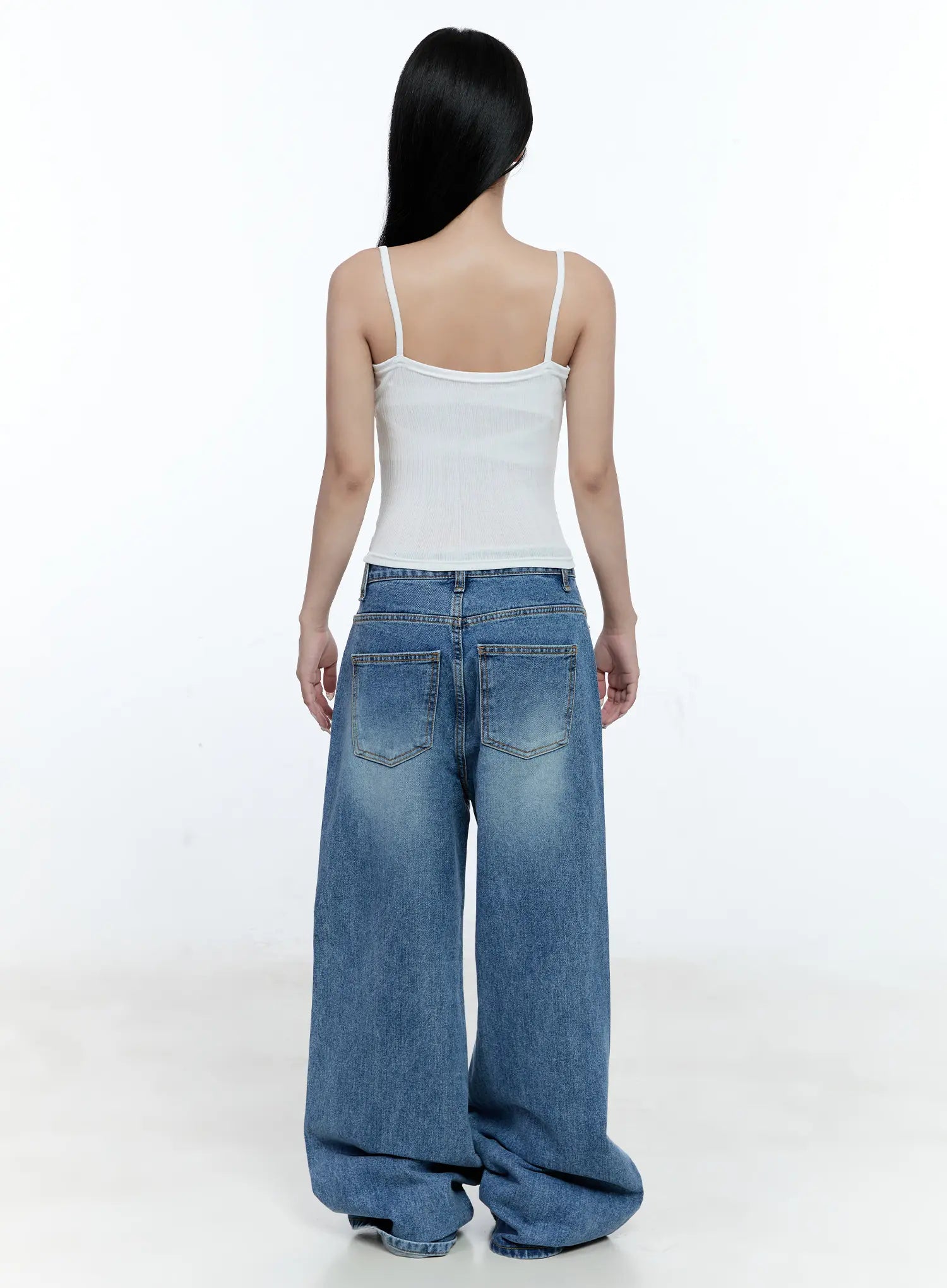 Ana Wide-Leg Denim Jeans CG507 in blue, full-length back view on model, washed wide-leg denim with back pockets, paired with white ribbed cami, hem pooling at floor.