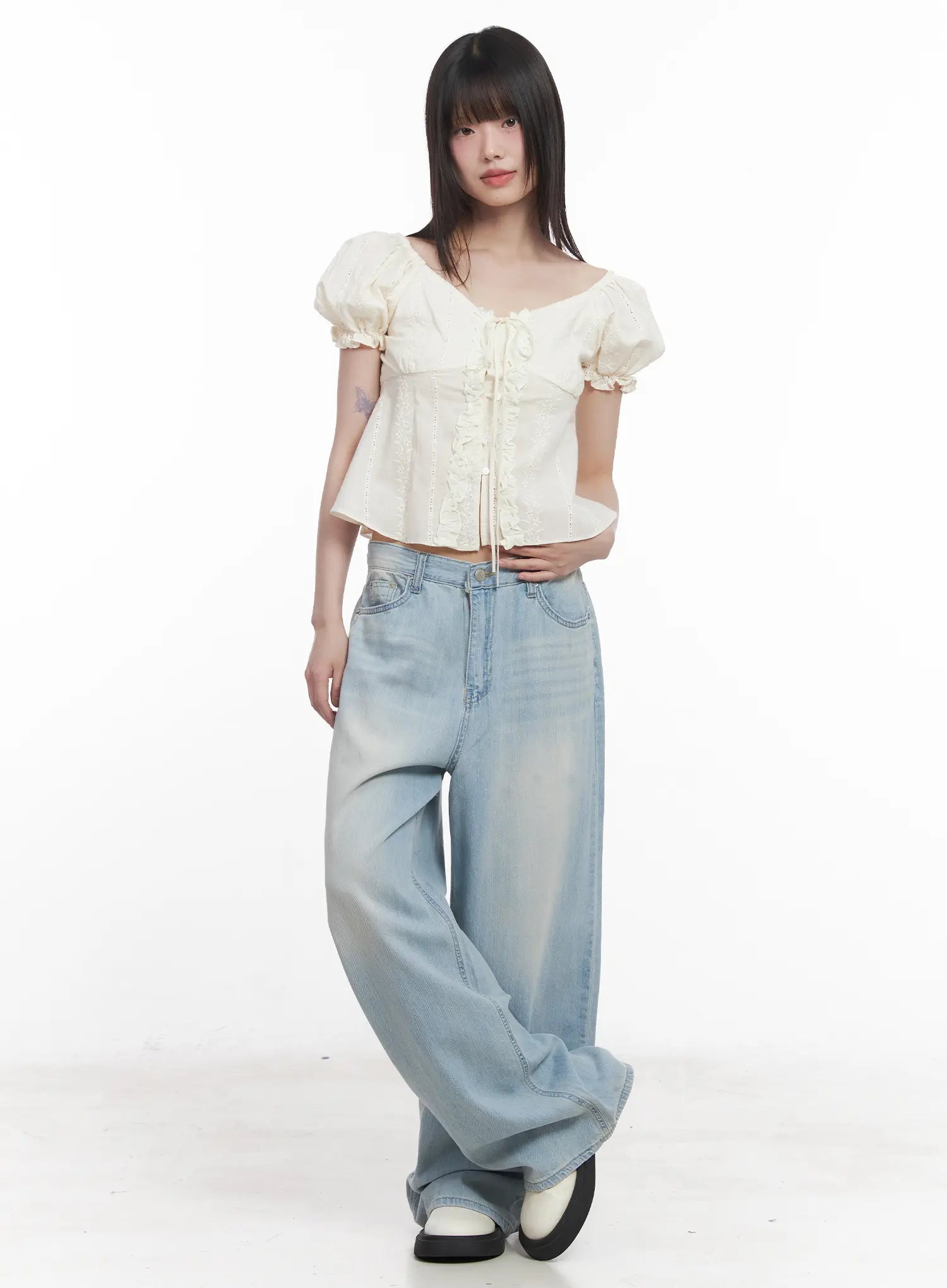 Garam Washed Wide-Leg Jeans CU518 in light blue, full-body front editorial shot on model, oversized wide-leg pooling hem, styled with cream lace-up corset top, street look.