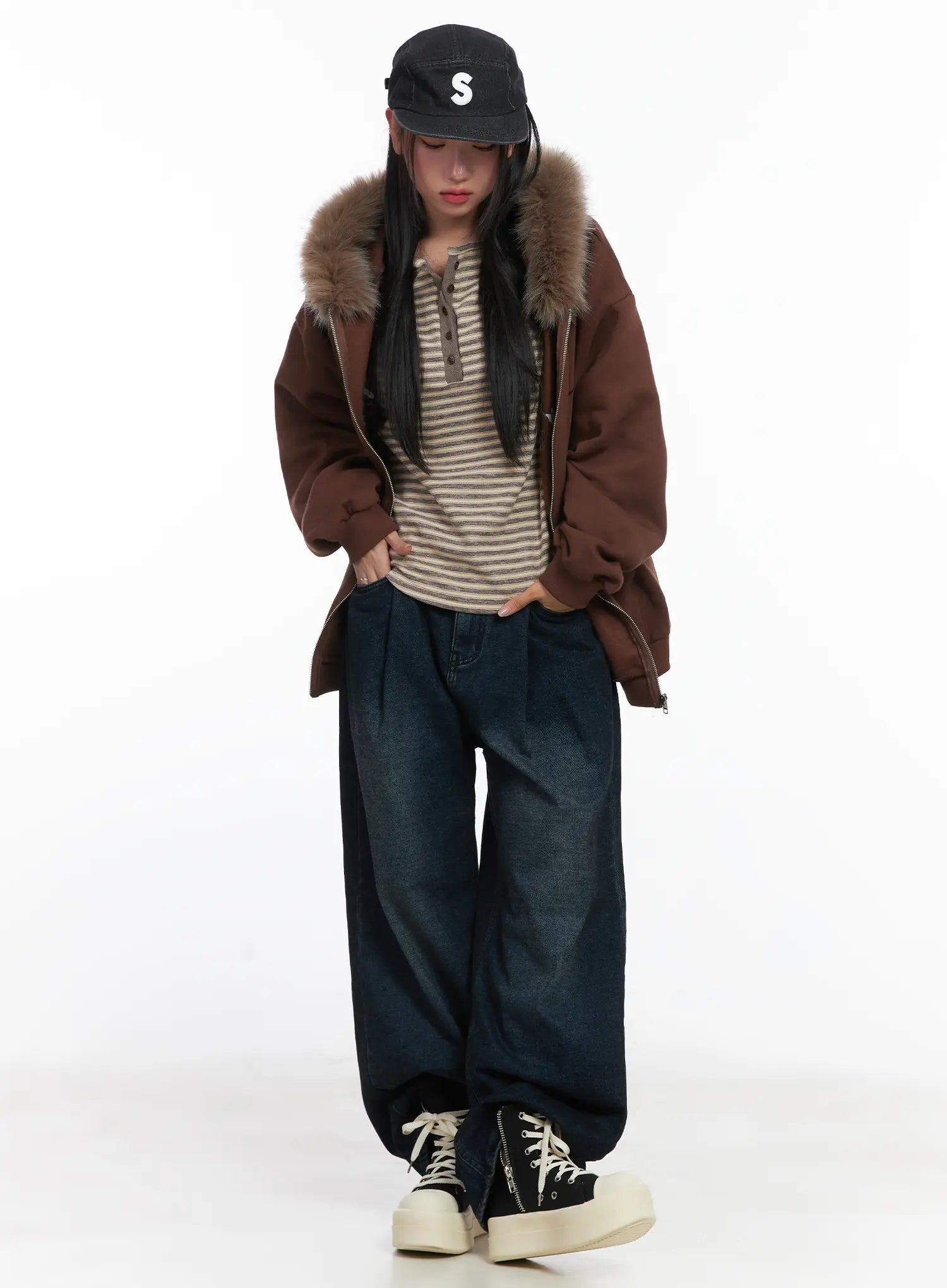 Lettie Fleece Pintuck Wide Leg Jeans CD529 in dark blue, full-body styling shot on model, washed wide-leg denim paired with fur-trim hooded jacket, striped top, and cap.