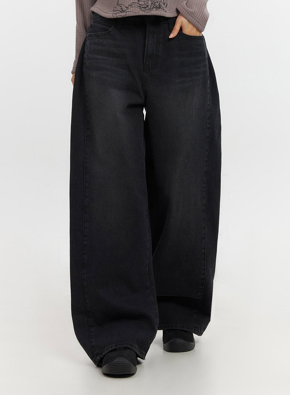 Ashly Wide-Leg Jeans IF511 in washed black, front lower-body mid-shot on model, voluminous wide-leg denim with washed finish, hand tucked into pocket.