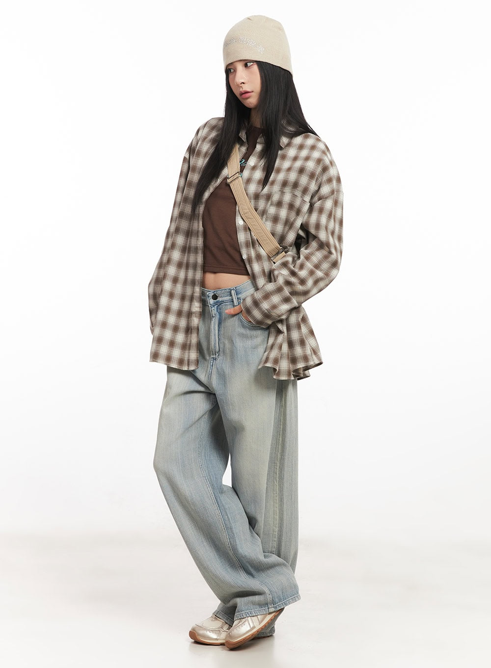 Jessi Washed Wide-Leg Jeans CA514 in light blue, three-quarter side shot on model, relaxed washed wide-leg jeans styled with plaid shirt, brown crop top, beige bucket hat, and crossbody bag.