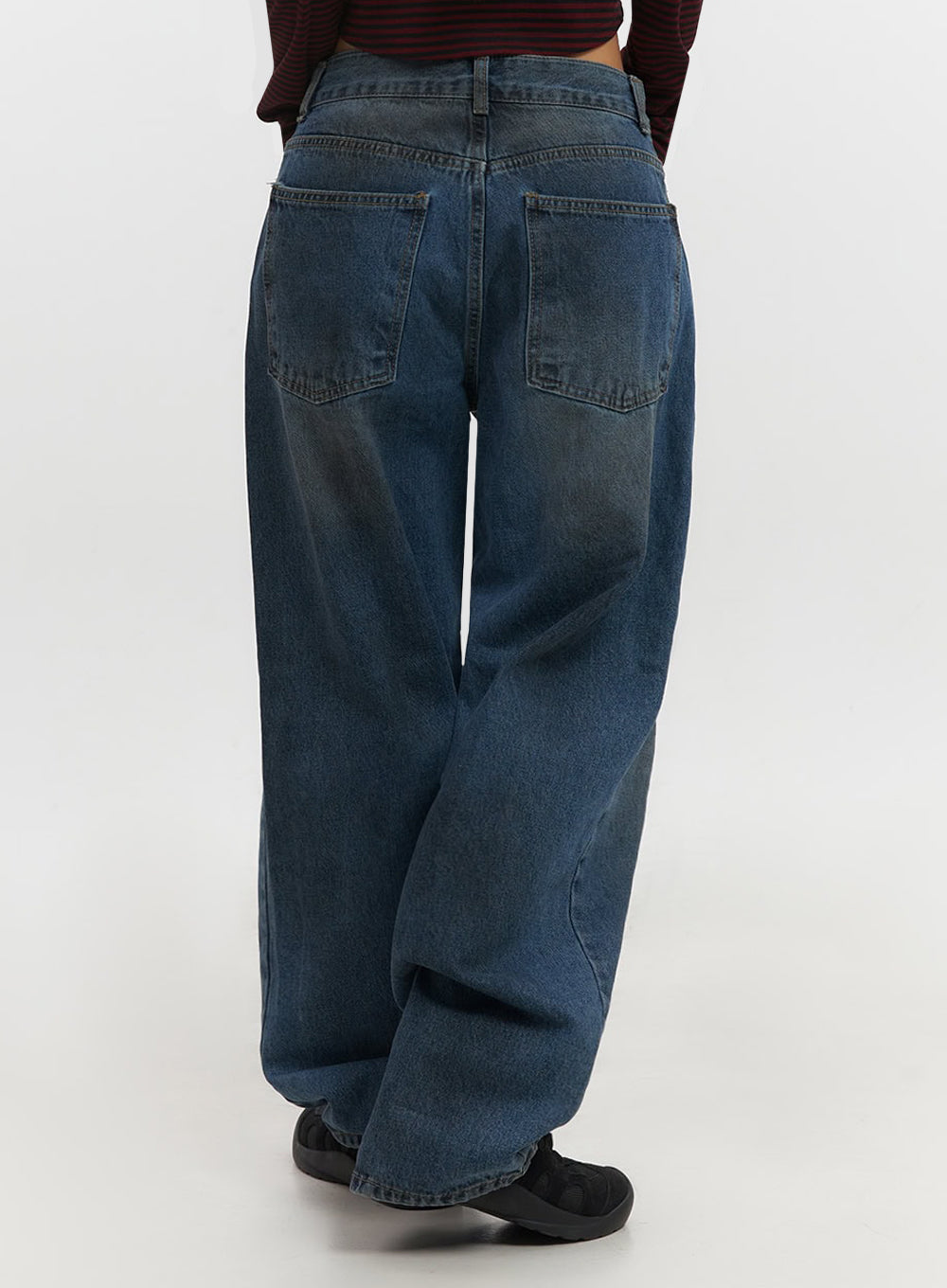 Brianna Dark Washed Wide-Leg Jeans IF510 in dark washed blue, back view close-up on model, two oversized patch pockets with topstitching, dark washed cotton denim, wide-leg hem pooling on floor.