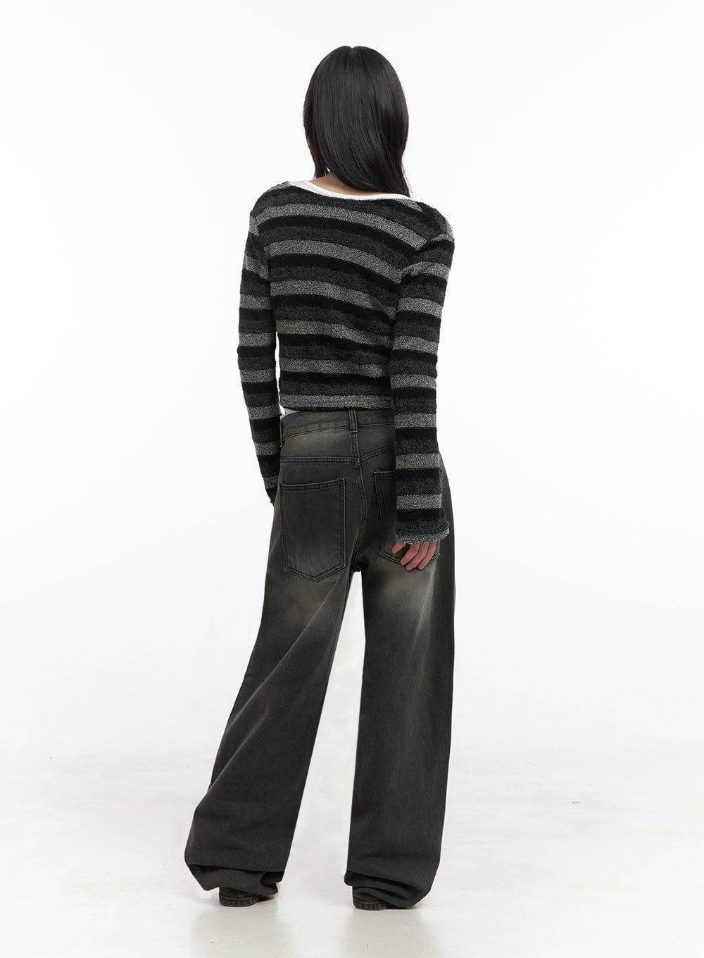 Matilda Wide-Fit Baggy Jeans ID402 in black, full back view on model, washed denim with faded gradient from hip to hem, roomy wide-leg silhouette, paired with striped crop cardigan.