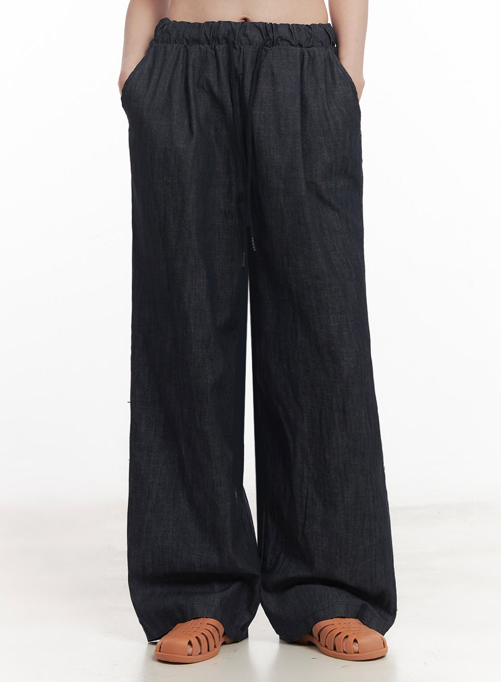 Cotton Denim Wide-Leg Pants IY509 in dark navy, front mid-body to hem shot on model, elastic banded waist without drawstring visible, ultra-wide leg cotton denim falling straight to floor.