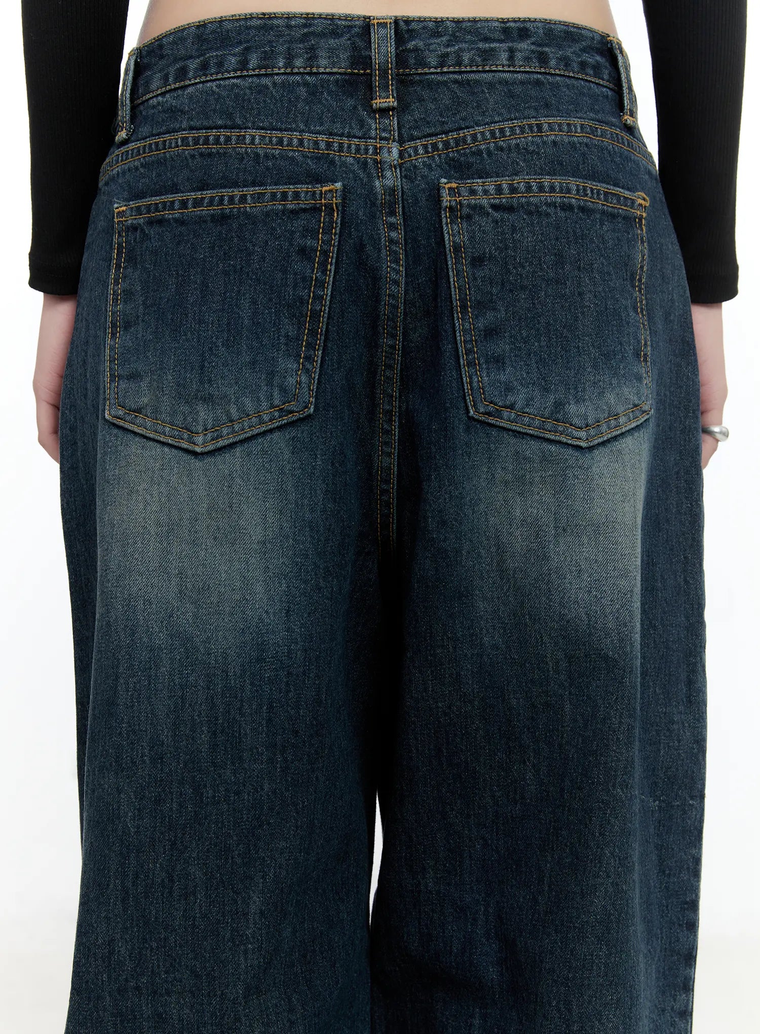 Hunter Washed Wide Leg Jeans CN517 in dark blue, close-up back waist detail on model, showing dual back pockets, gold topstitching, washed texture and belt loops clearly visible.