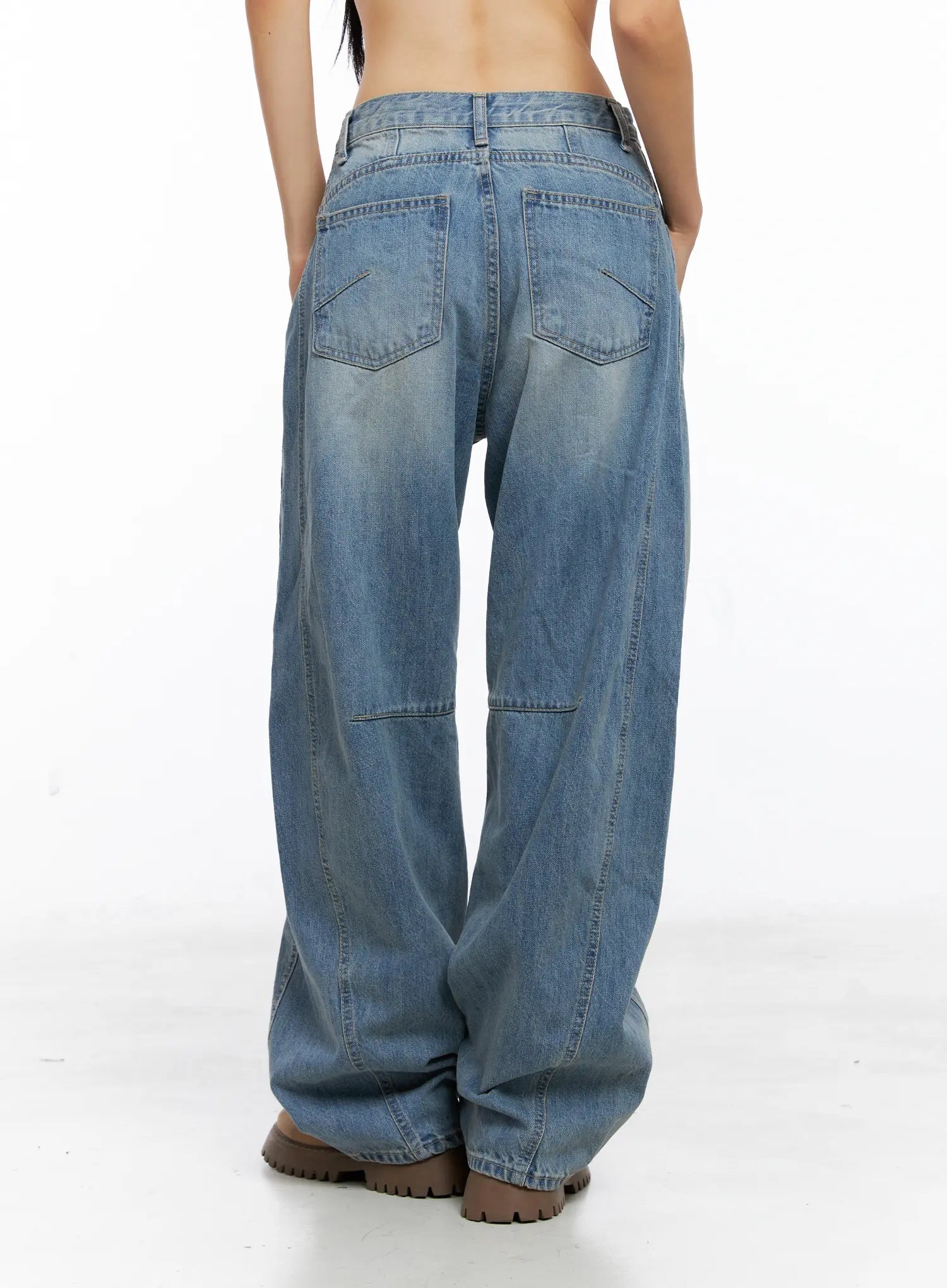 Dakota Relaxed Fit Vintage Wash Jeans CS511 in blue, back close-up studio shot from waist to hem, showing back patch pockets, yoke stitching, curved knee panel seam, and vintage wash cotton denim.