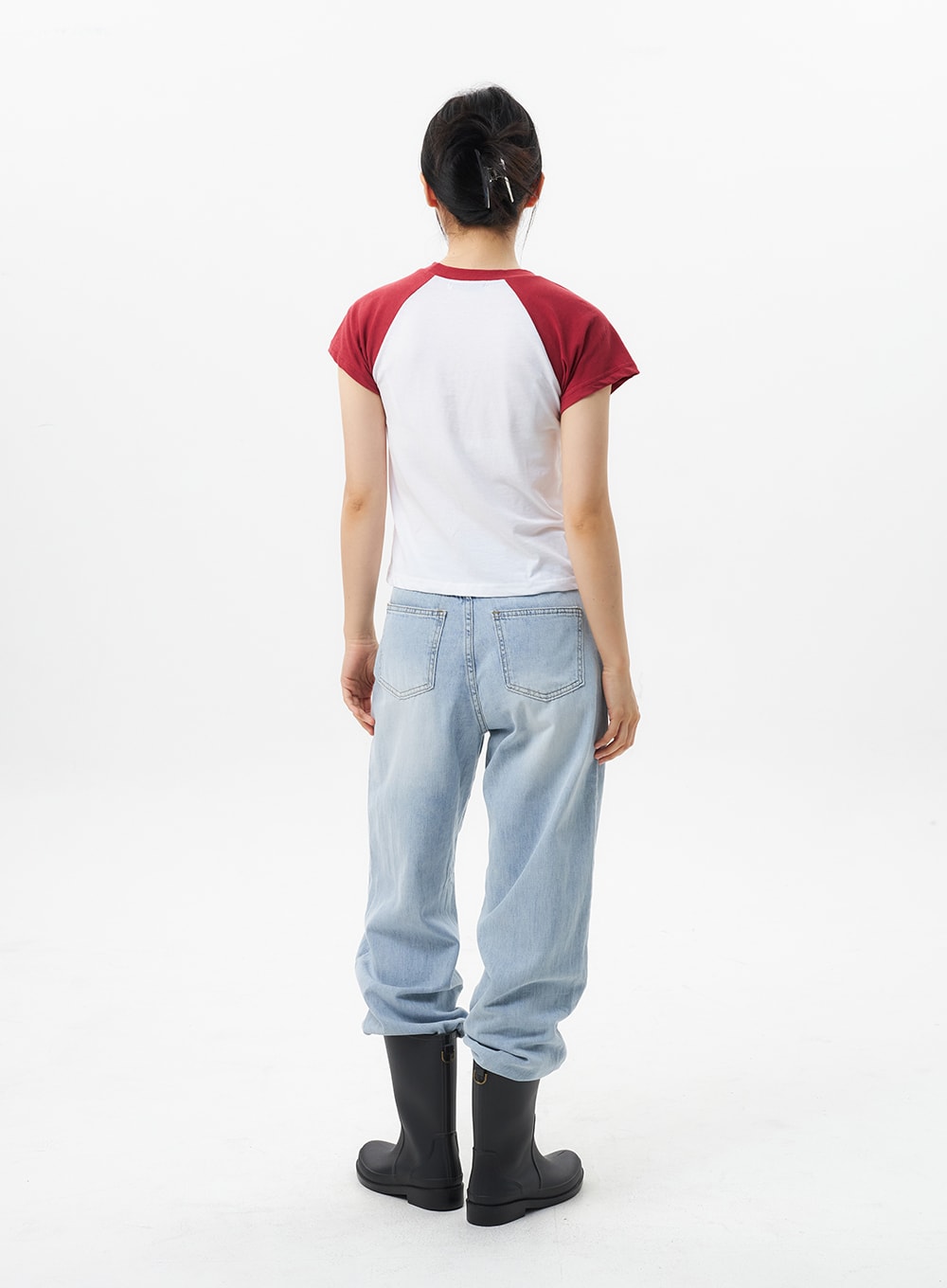 Wide Straight Leg Jeans OL304 in light blue, full back view on model, wide-leg cotton denim with faded wash, dual back pockets, hem bunched above black rain boots.